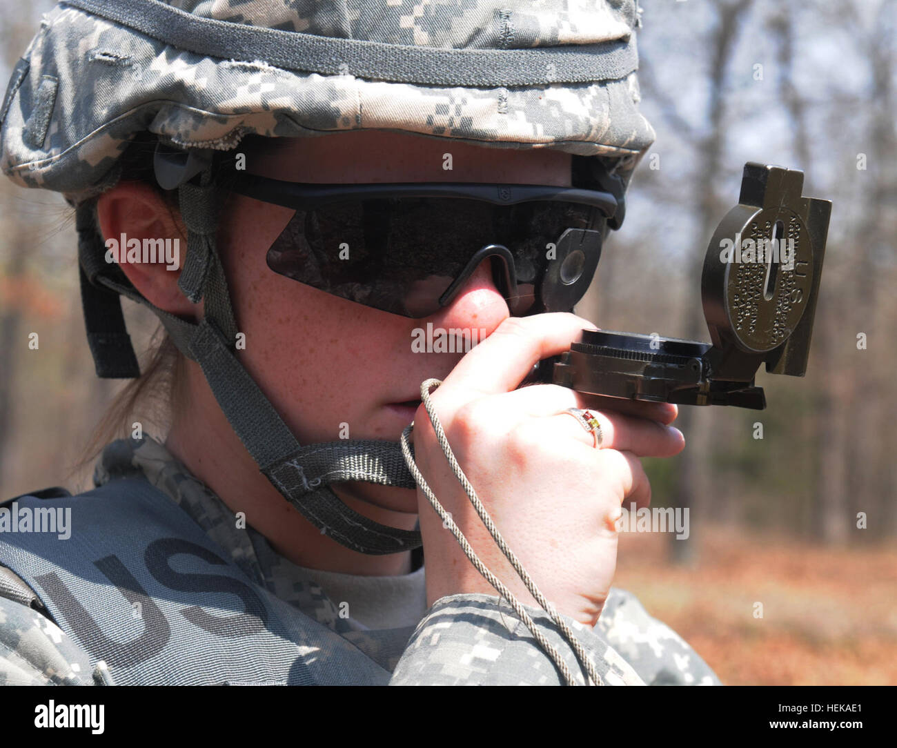 Pfc. Cassie Kogle, 11-100 Military Intelligence Battalion, 100th Division, shoots an azimuth with a compass during the land navigation portion of the 80th Training Command (TASS) 2013 Best Warrior Competition, Fort Leonard Wood, Mo., April 17, 2013. 102nd Training Division (MS) hosts 80th Training Command (TASS) 2013 Best Warrior Competition 130417-A-KD890-389 Stock Photo