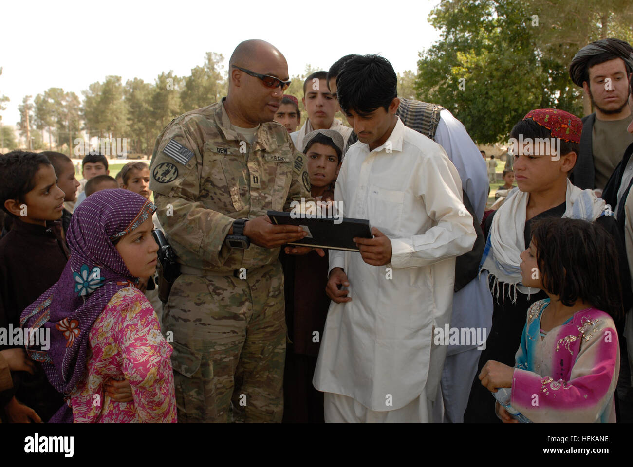 The 1st Brigade Combat Team, Task Force Raider, presents an award to a ...
