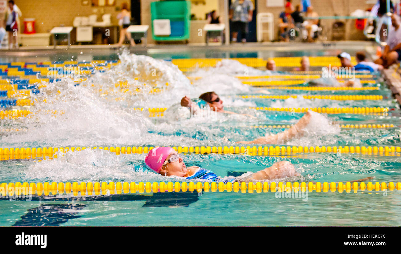 Wounded veteran athletes compete in the 100meter backstroke during the