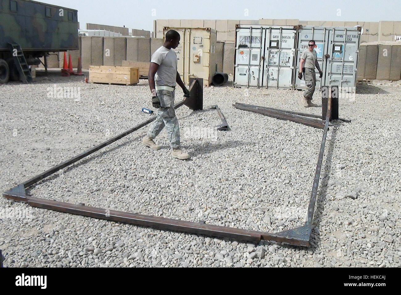 Sapper Construction Spc. Doxton Johnson and Pvt. David Poirier, engineers with Company C ...