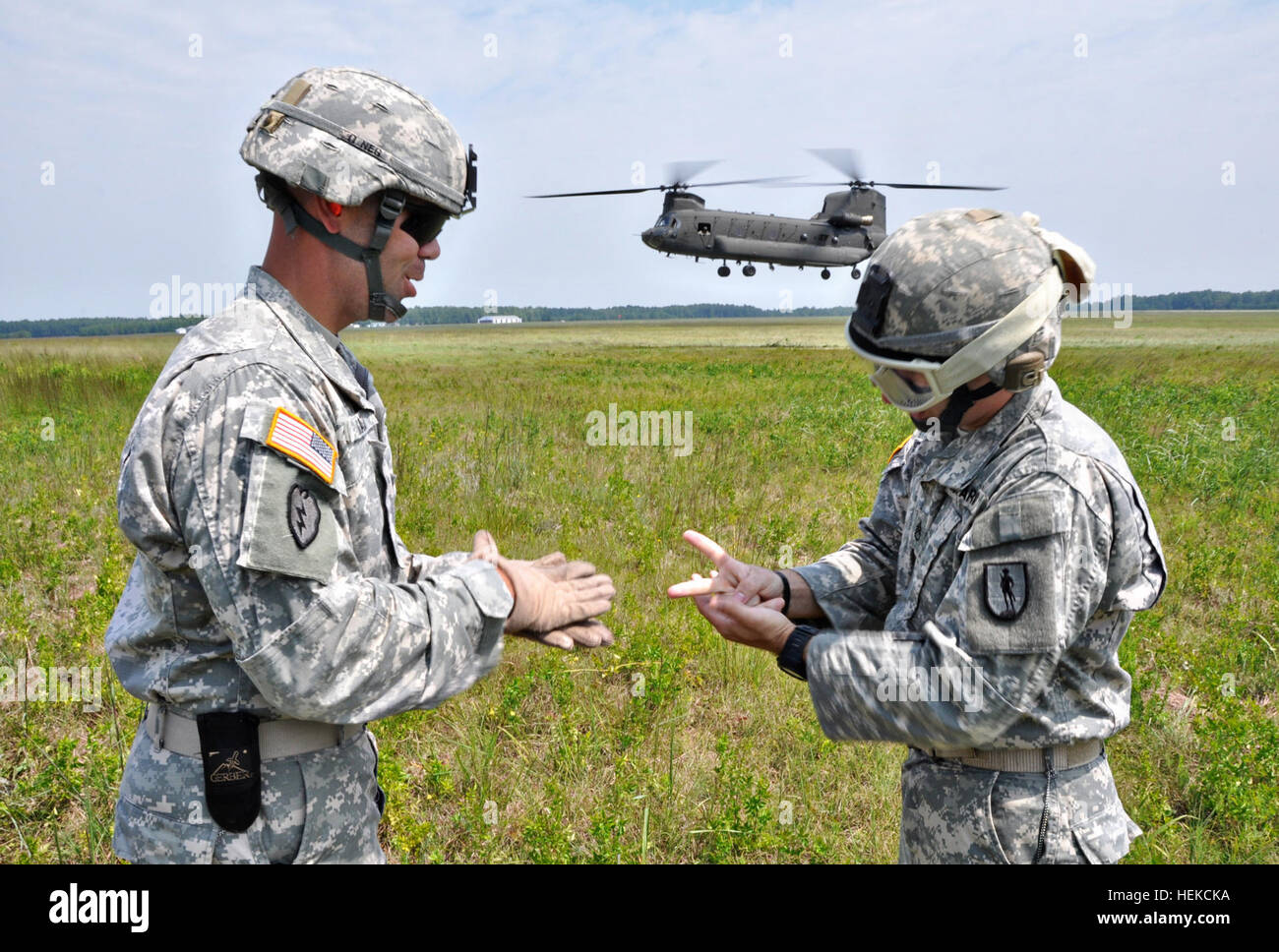 Soldiers from the Fort Benning-based Warrior Training Center teach students sling load operations a CH-47 Chinook helicopter during U.S. Army Pathfinder School at Fort Pickett, Va., Aug. 19. The mission of a Pathfinder is to provide technical assistance and advise the ground unit commander on combat assault operations, sling load operations, air movement, airborne operations, and aerial re-supply by fixed and rotary wing aircraft. Pathfinder course comes to Virginia 110819-A--890 Stock Photo