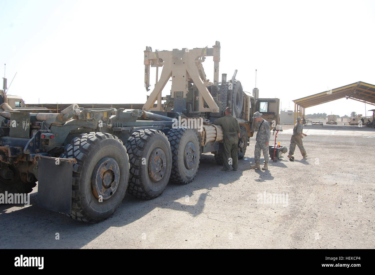 Soldiers with Company F, 1st “Vanguard” Battalion, 18th Infantry Regiment, 2nd Advise and Assist Brigade, 1st Infantry Division, United States Division–Center prepare a palletized load system vehicle for turn-in Aug. 20, 2011 at Camp Taji, Iraq. Part of the turn-in process is ensuring equipment is thoroughly cleaned and inventoried. (Photo by: Spc. William A. Joeckel, 2nd AAB, 1st Inf. Div., USD-C) %%%%%%%%E2%%%%%%%%80%%%%%%%%98Vanguard%%%%%%%%E2%%%%%%%%80%%%%%%%%99 Battalion soldiers prepare for drawdown by turning in vehicles and equipment 446758 Stock Photo