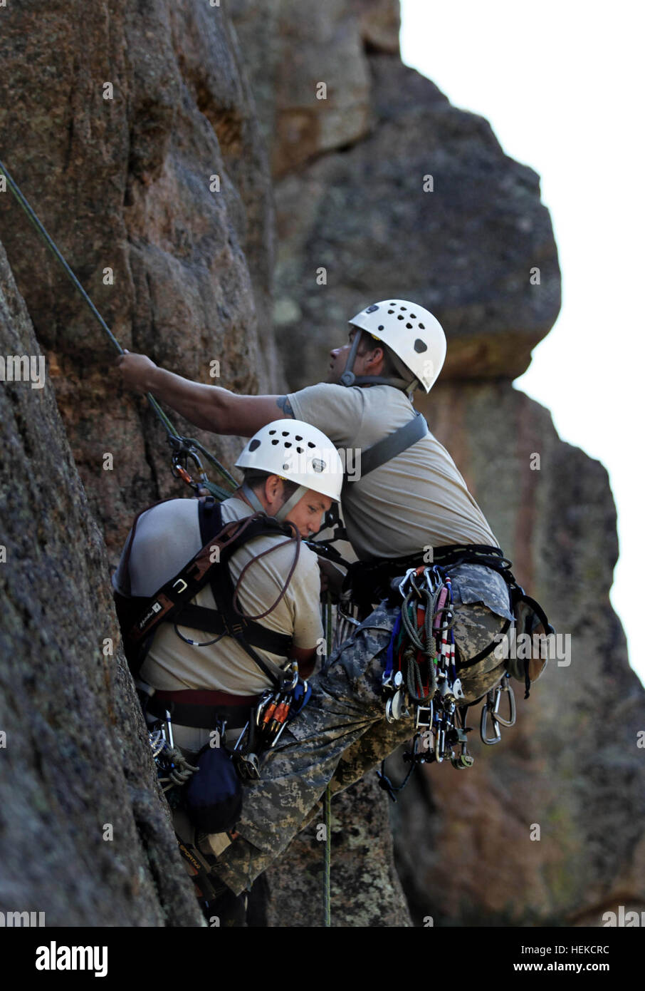 Soldiers attending the U.S. Army Special Forces Command (A) Mountaineering Program conduct Senior Course Level II  training near Fort Carson, Colo., after completing the Basic Course (Level III) where team members learned 15 basic tasks, including navigating in mountainous terrain, rope commands, transportation of a casualty on an improvised litter and rappelling techniques. During Level II, the soldiers are expected to know and pass a hands-on test on the basic fundamentals of rock climbing throughout the course. Among the 17 tasks in the Senior Course they must be proficient at constructing  Stock Photo