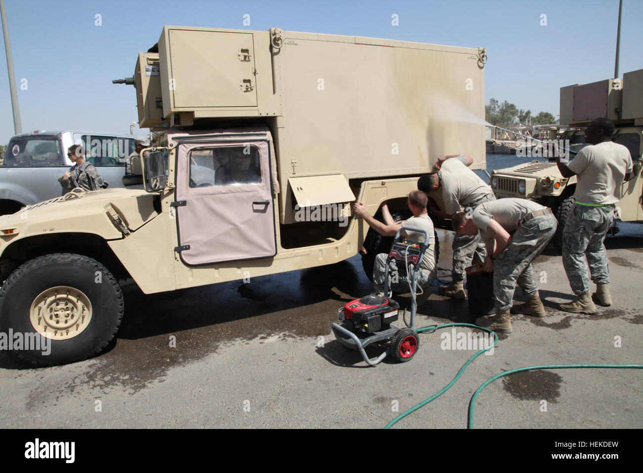 U.S. Army soldiers from the United States Forces - Iraq J2 shop clean their vehicles and equipment at Al-Faw Palace on Victory Base Complex in Baghdad, Iraq, Sept. 11, 2011. The soldiers are preparing this equipment for its return to the United States as part of the draw down in support of Operation New Dawn. (U.S. Army photo by Sgt. Matthew Friberg/Released) Troops clean vehicles on Victory Base Complex 110911-A-JL274-006 Stock Photo