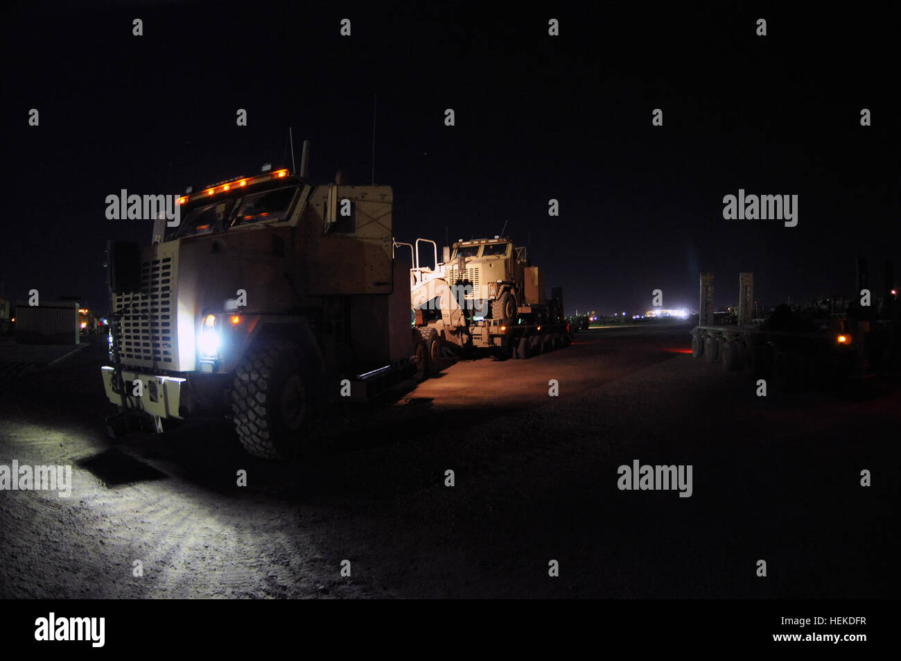 Soldiers of the 129th Transportation Company, prepare their vehicles prior to departing on a convoy mission,  Sept. 12, 2011, at Joint Base Balad, Iraq. The 129th are Reserve soldiers out of New Century, Kan., assigned to assist the 230th Sustainment Brigade’s Joint Task Force Hickory, to haul equipment out of closing forward operating bases as part of the responsible withdraw of U.S. Forces by the Dec. 31 deadline. Joint Task Force Hickory 110912-A-BS900-037 Stock Photo