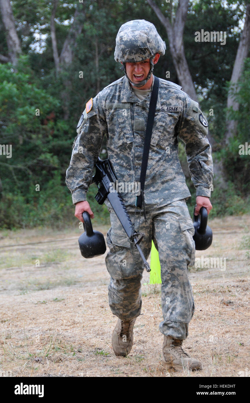 Sgt. Ryan Williams of Yucaipa, Calif., a military police officer with the 40th Military Police Company, 185th Military Police Battalion, 49th Military Police Brigade, carries kettle balls back and forth as part of the Army Combat Readiness Test portion of the Best Warrior Competition at Camp San Luis Obispo, Calif., Sept. 14. California National Guard soldiers compete in the 2011 Best Warrior Competition 110914-A-XQ016-012 Stock Photo