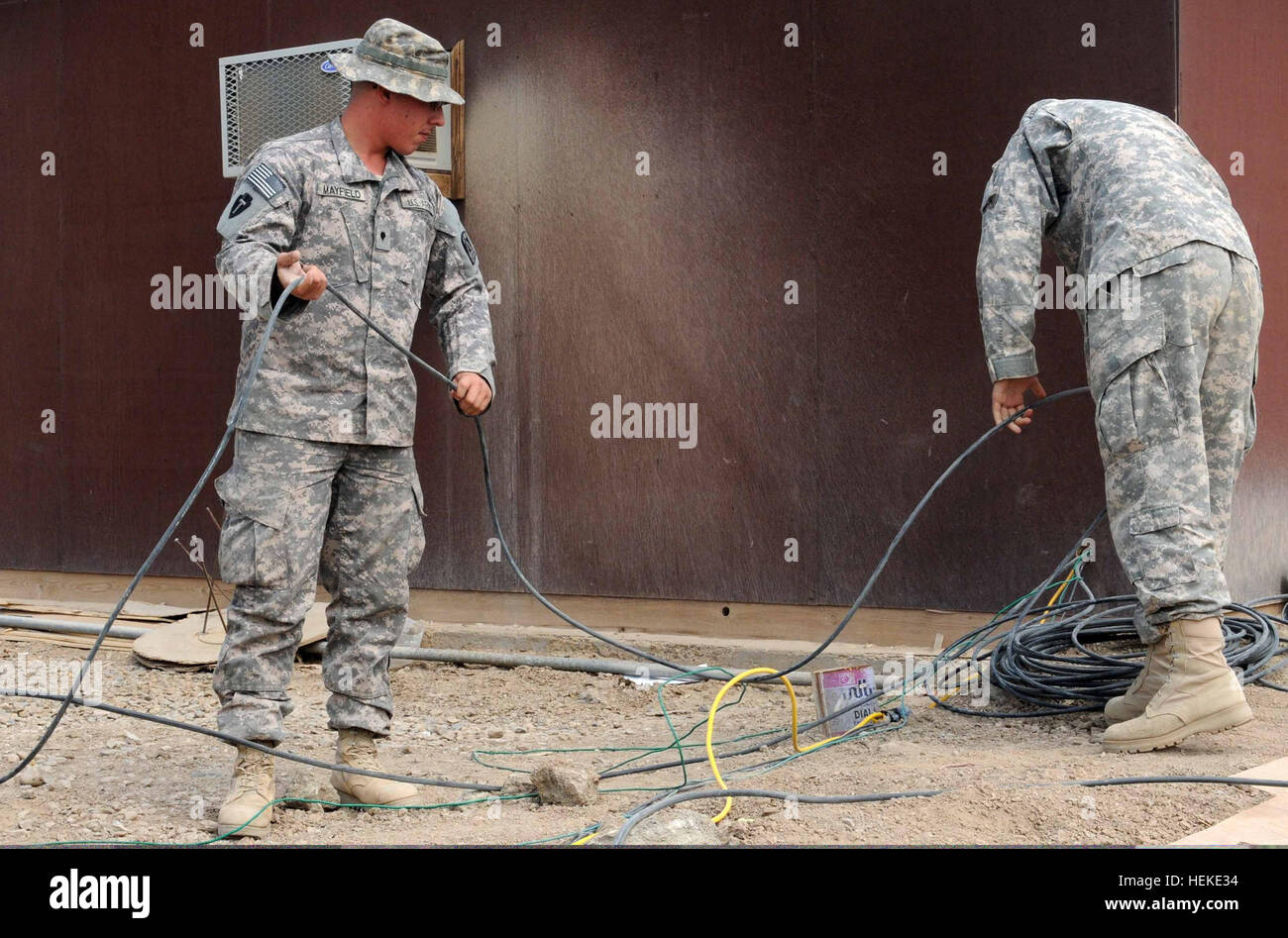 Spc. David Mayfield (left), satellite communications operator and maintainer, Company A, 62nd