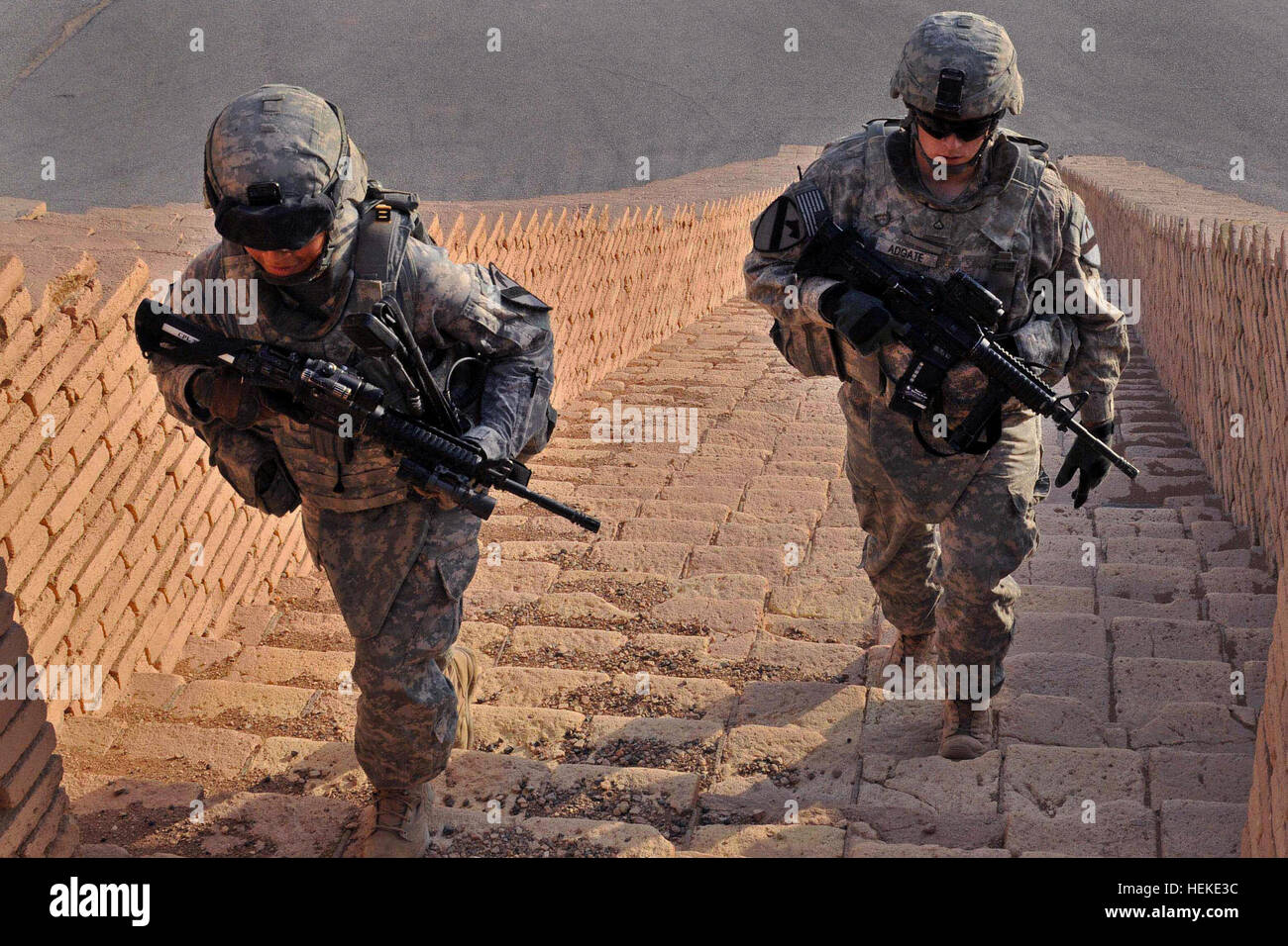 Cpl. Kristine Tejeda and Pfc. Thomas Adgate, Headquarters Battery, 2nd Battalion, 82nd Field Artillery Regiment, 3rd Advise and Assist Brigade, 1st Cavalry Division, or Task Force Steel Dragon, climb the steps of the Ziggurat of Ur to provide security for a tour of the ancient city in Dhi Qar province, Sept. 24. Soldiers of Steel Dragon have provided security for more than 20 tours of the ancient city of Ur since December 2010. Flickr - The U.S. Army - Stair sentinels Stock Photo