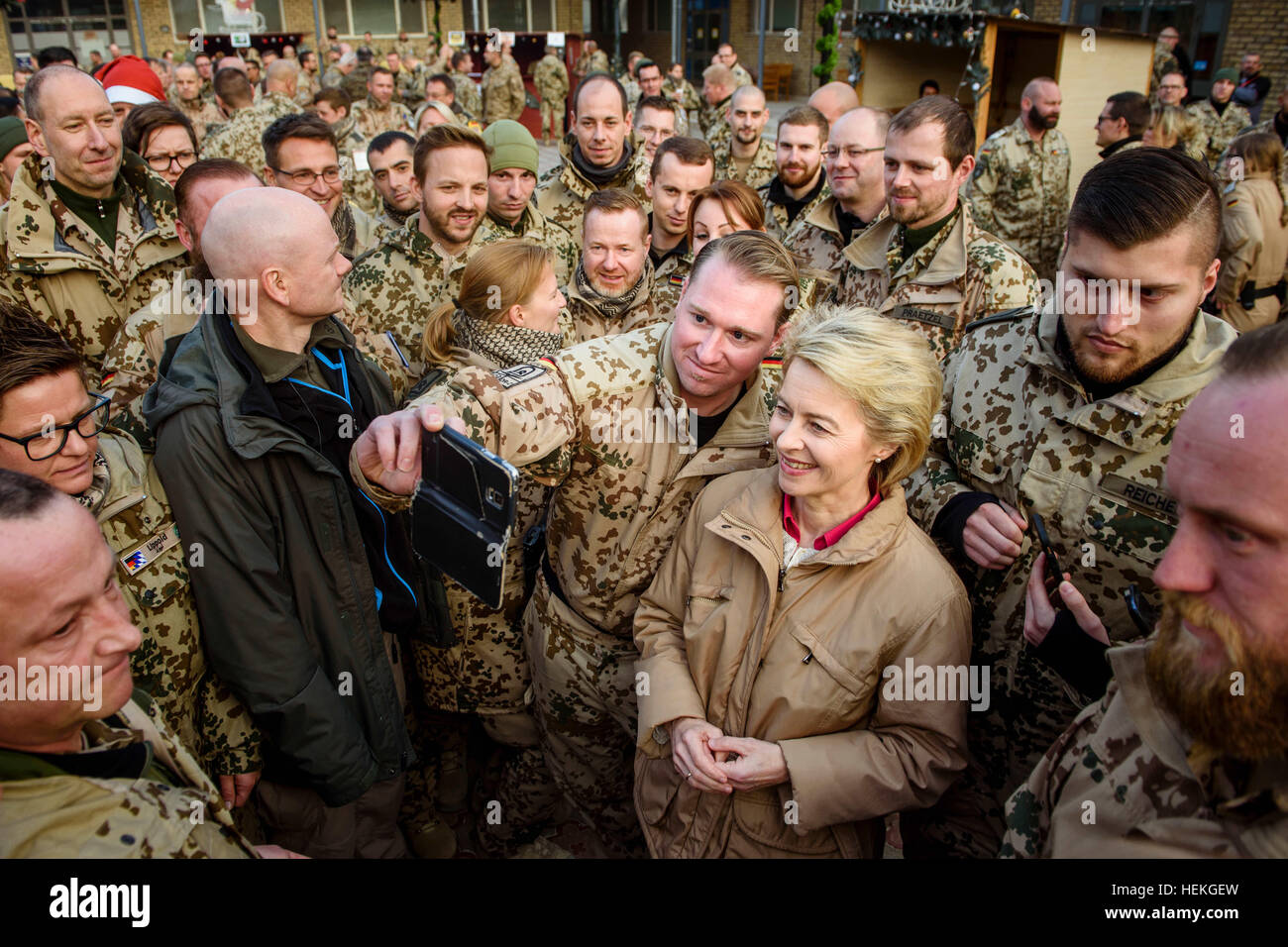 Masar-i-Sharif, Afghanistan. 22nd Dec, 2016. The German Defence Minister Ursula von der Leyen takes selfies with German soldiers at the Christmas market in Camp Marmal in Masar-i-Sharif, Afghanistan, 22 December 2016. Von der Leyen is in the country for the traditional visit of the minister of defence to German troops at Christmas. Photo: Gregor Fischer/Pool/dpa/Alamy Live News Stock Photo