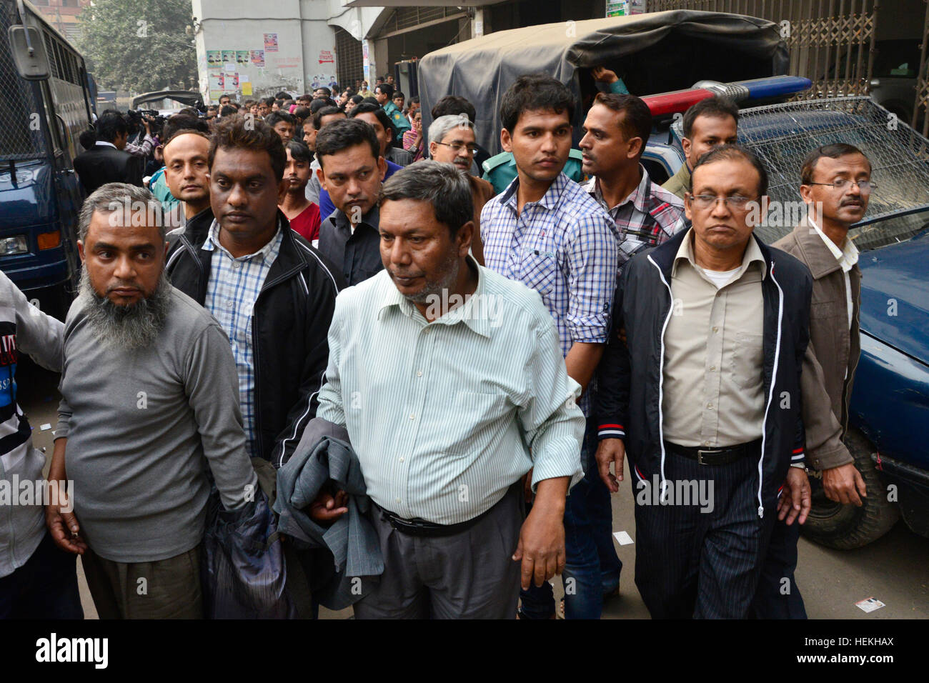Dhaka, Bangladesh. 22nd Dec, 2016. Bangladesh police escort seven officials of Biman Bangladesh Airlines towards the Metropolitan Magistrate court as suspects in a case filed over emergency landing of a Biman flight carrying Prime Minister Sheikh Hasina to Budapest on November 27 in Dhaka. Bangladesh. On December 22, 2016 A Dhaka court placed seven officials of Biman Bangladesh Airlines on seven-day remand each in connection with the case filed over technical glitch of Prime Minister Sheikh Hasina's flight. Credit: Mamunur Rashid/Alamy Live News Stock Photo