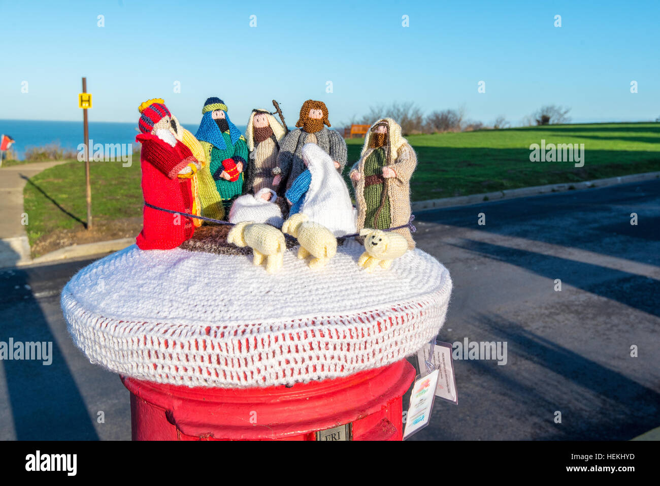 Herne Bay, Kent, UK. 22nd Dec, 2016. Many of the post boxes in Herne Bayhave been topped by knitted characters with a Christmas Theme such as this nativity scene on Beacon Hill. The toppers are the work of a local knitting group called the 'Herne Bay Cosy Crew' © Paul Martin/Alamy Live News Stock Photo