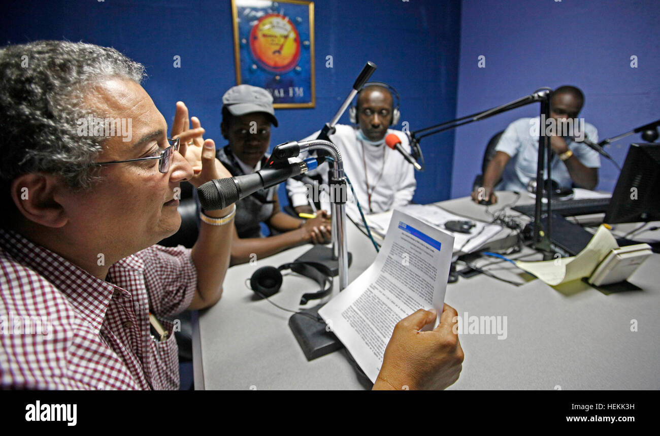 December 22, 2016 - Port-Au-Prince, Florida, U.S. - 012310 (Lannis  Waters/The Palm Beach Post) PETIONVILLE, HAITI - Michel Soukar (cq), left,  is on the air with other journalists from Signal FM radio