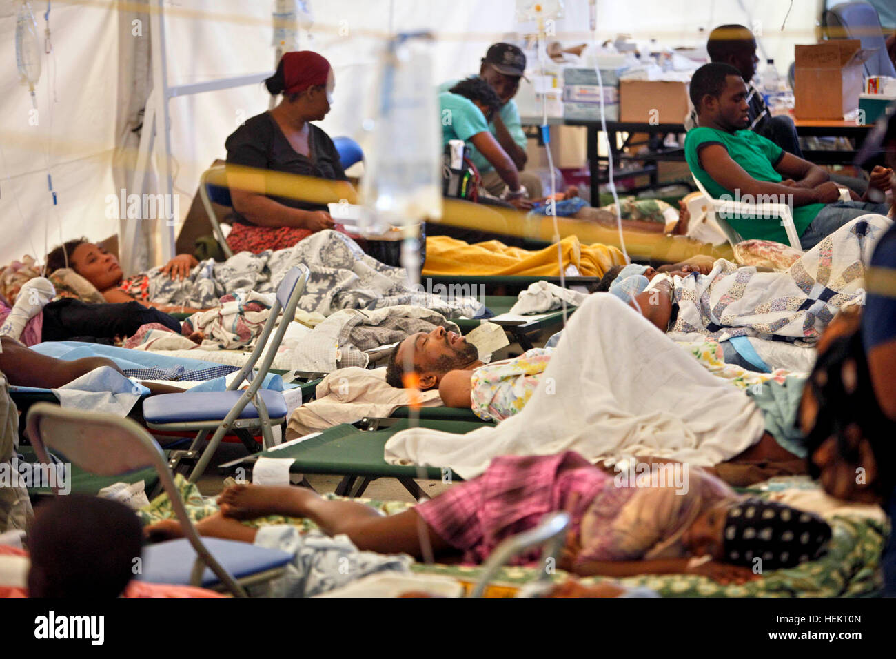 December 23, 2016 - Port-Au-Prince, Florida, U.S. - 011710 (Lannis Waters/The Palm Beach Post) PORT-AU-PRINCE, HAITI - Patients and their families in the Project Medishare Triage Center at the United Nations compound at the airport. Dr. Dan Kairys (cq), a surgeon at Lakeside Medical Center in Belle Glade, and his wife Junia Kairys (cq), a physician's assistant, worked at the center. (Credit Image: © Lannis Waters/The Palm Beach Post via ZUMA Wire) Stock Photo