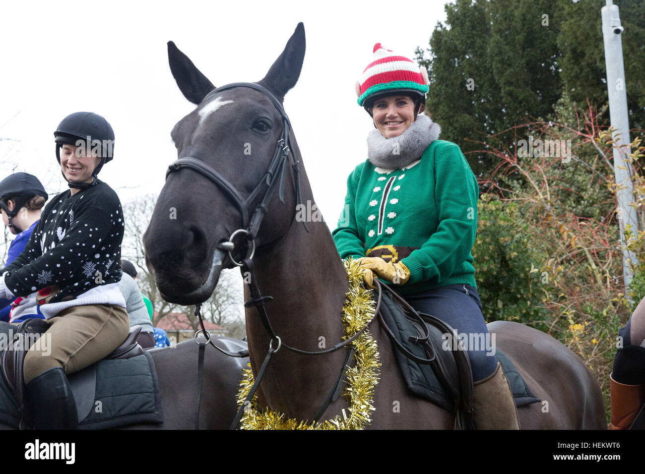 London, UK. 24th Dec 2016. Soldiers from the King's Troop Royal Horse Artillery and their horses wear Christmas outfits, tinsel and santa hats as they ride out on Christmas Eve morning. The soldiers left Woolwich Barracks and trotted through south east London streets to Morden College in Blackheath, where the soldiers were greeted with mulled wine and minced pies. The annual event has become a new Christmas tradition since the KingÕs Troop moved to purpose built barracks in Woolwich in February 2012. Credit: Vickie Flores/Alamy Live News Stock Photo