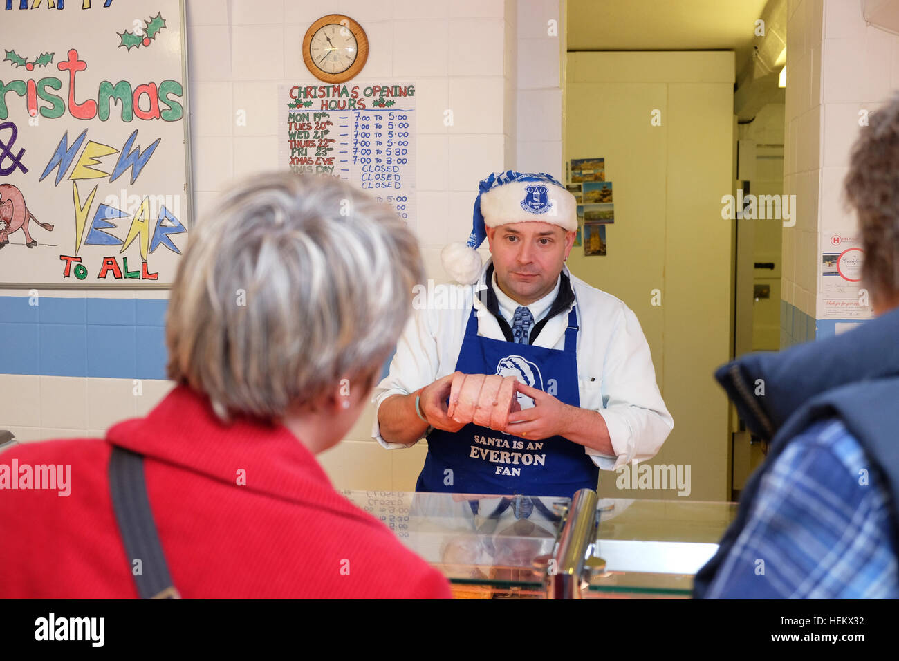 Presteigne, Powys, Wales - Saturday 24th December 2016 - Customers collect their Christmas fresh meat orders from the Carini Butchers shop in Presteigne a small town in mid Wales. Steven May / Alamy Live News Stock Photo