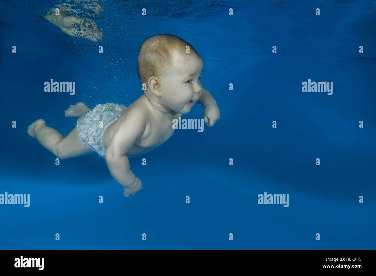 Odessa, Ukraine. 15th Dec, 2016. infant learning to swim underwater in