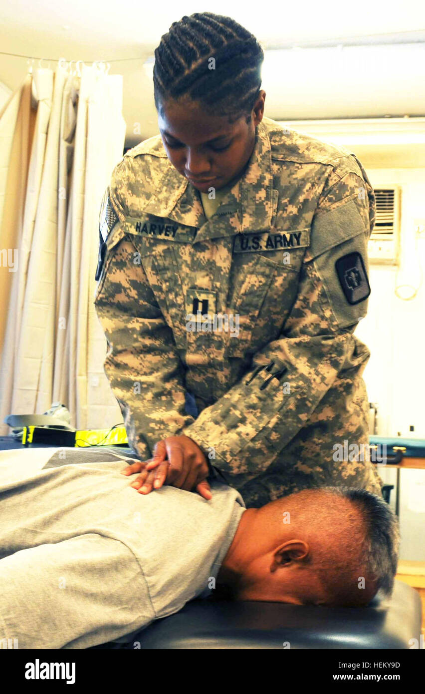 Army physical therapist provides spinal treatment to a soldier at the ...