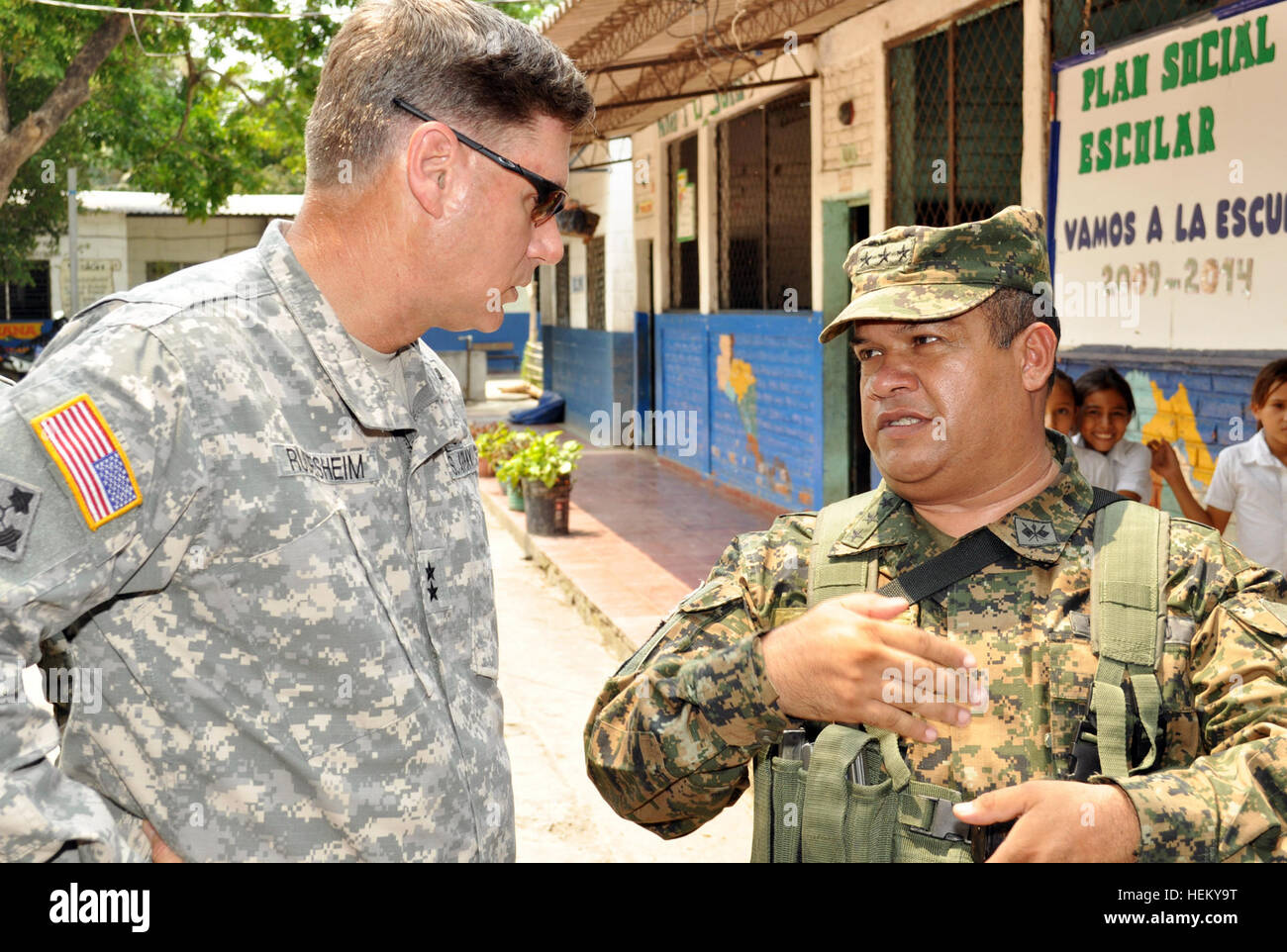 U.S. Army Maj. Gen. Frederick Rudesheim, left, the commanding general of U.S. Army South discusses construction progress and security with Salvadoran Col. Elmer Enrique Arevalo, the security battalion commander, as they tour the site of a new schoolhouse during Beyond the Horizon at Rancho San Marcos, El Salvador, May 8, 2013. Beyond the Horizon is a Chairman of the Joint Chiefs of Staff-directed, U.S. Southern Command-sponsored joint and combined field training humanitarian exercise in which troops specializing in engineering, construction and health care provide much-needed services to commu Stock Photo