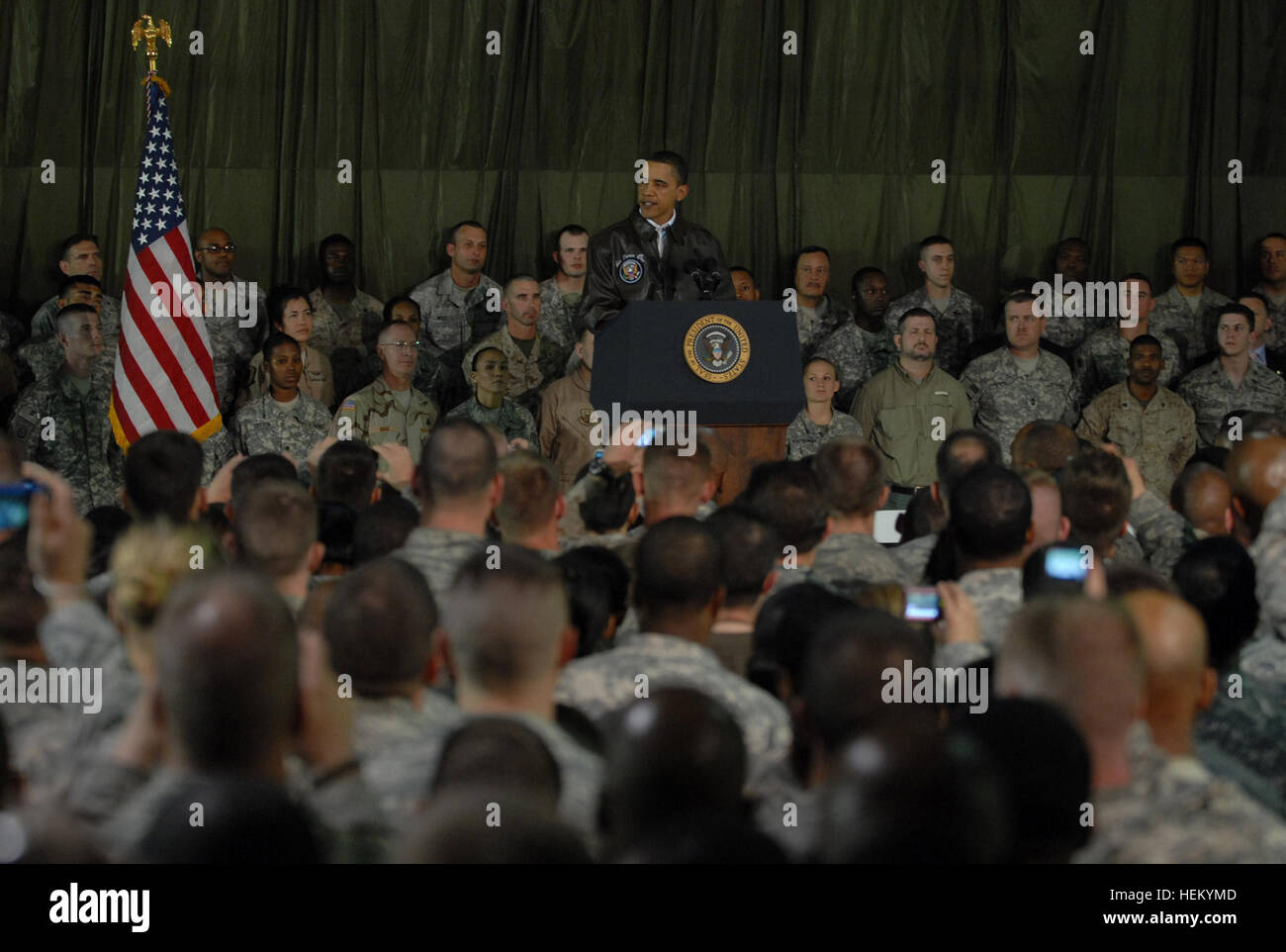 BAGRAM AIRFIELD, Afghanistan – The President of the United States Barack Obama gives a speech to servicemembers and civilians stationed at Bagram Airfield during surprise visit to Afghanistan, March 28. Prior to speaking to the troops, Obama flew to Kabul to meet with Afghanistan’s president Hamid Karzai. (Photo by U.S. Army Spc. Jay Venturini, 304th Public Affairs Detachment) President Barack Obama Visits Bagram Airfield 264188 Stock Photo