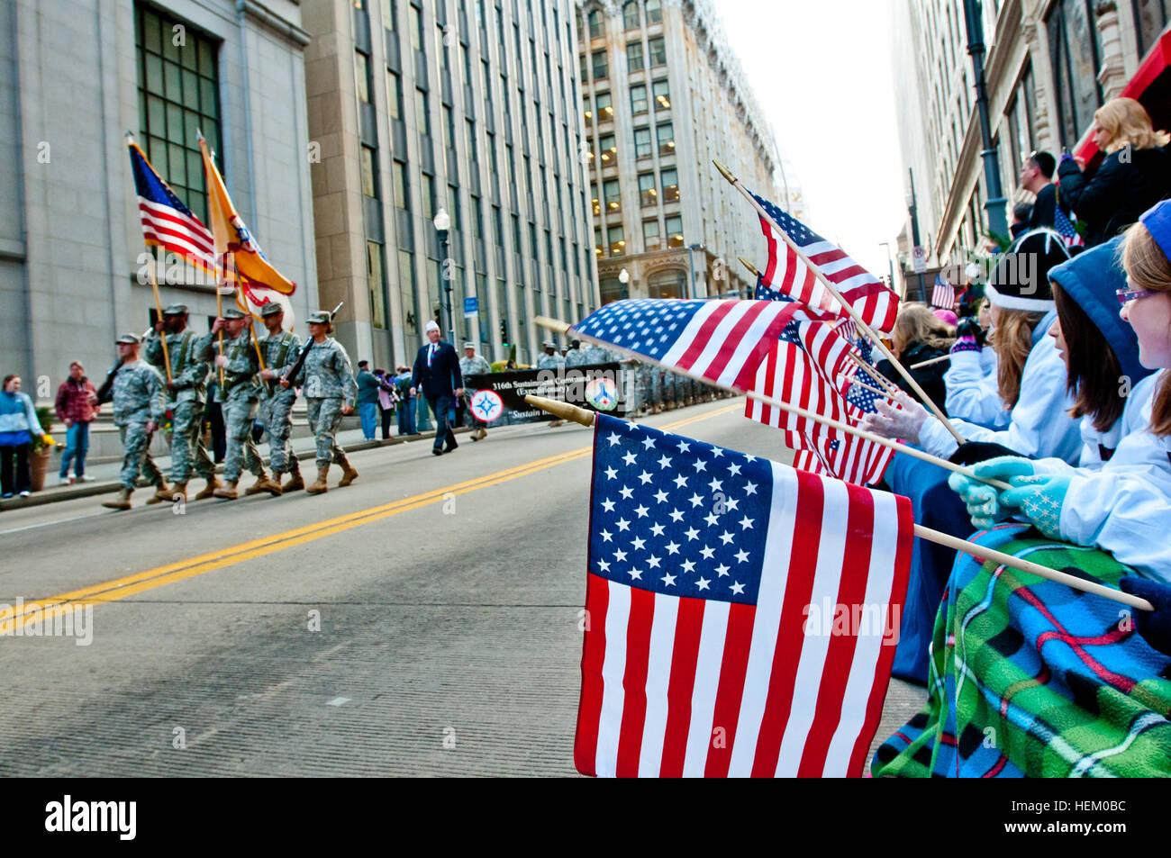 Children wave American flags in support of veterans and military