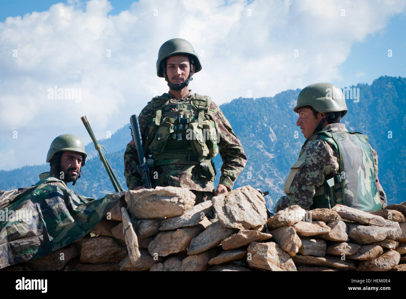 An Afghan National Army Soldier Poses While His Comrades Look On In The 
