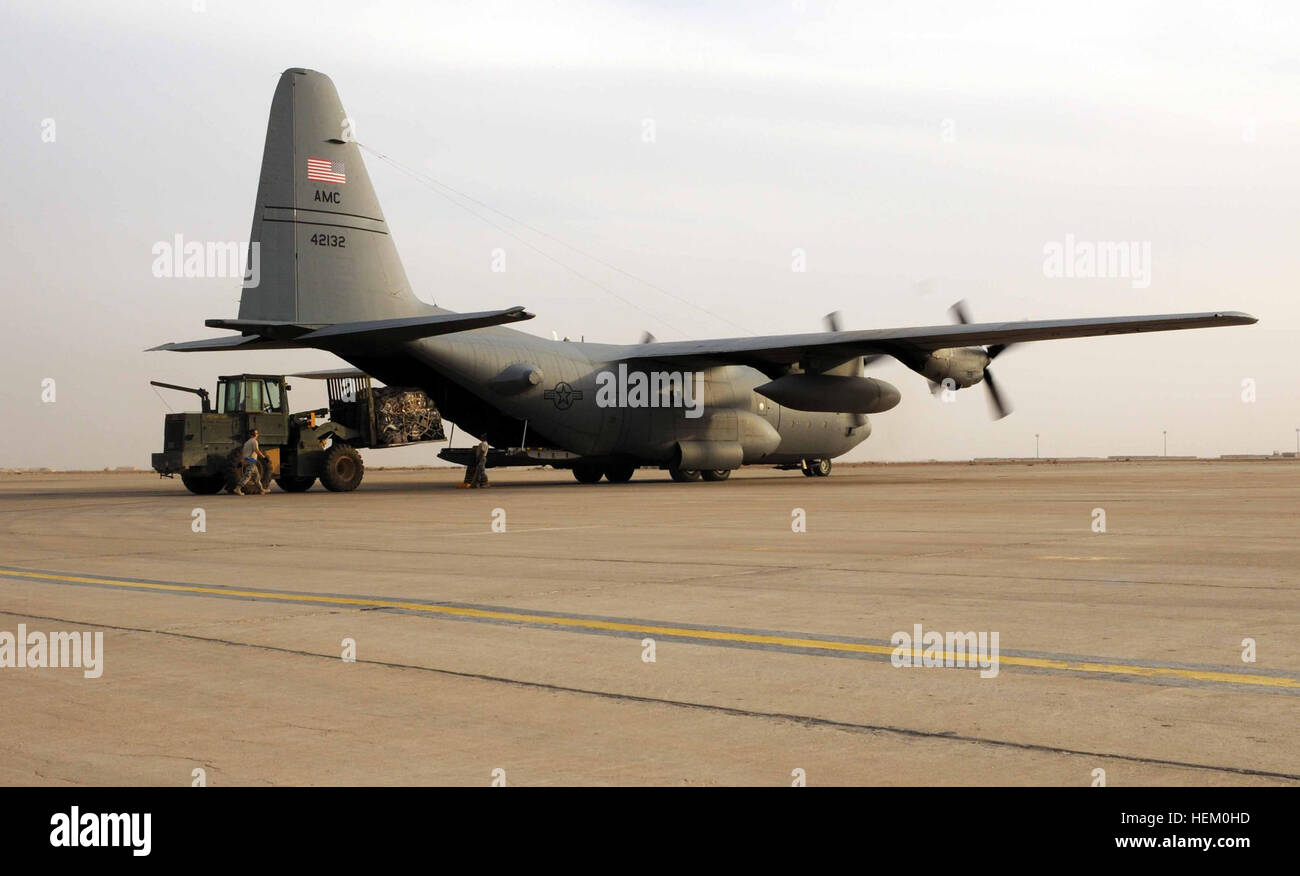 A pallet of luggage is loaded onto a C-130 aircraft at Ali Air Base just before take off on Contingency Operating Base Adder Nov. 18. Leaving on a jet plane, Air Force welcomes service members to the flightline home 111118-A-IX584-179 Stock Photo