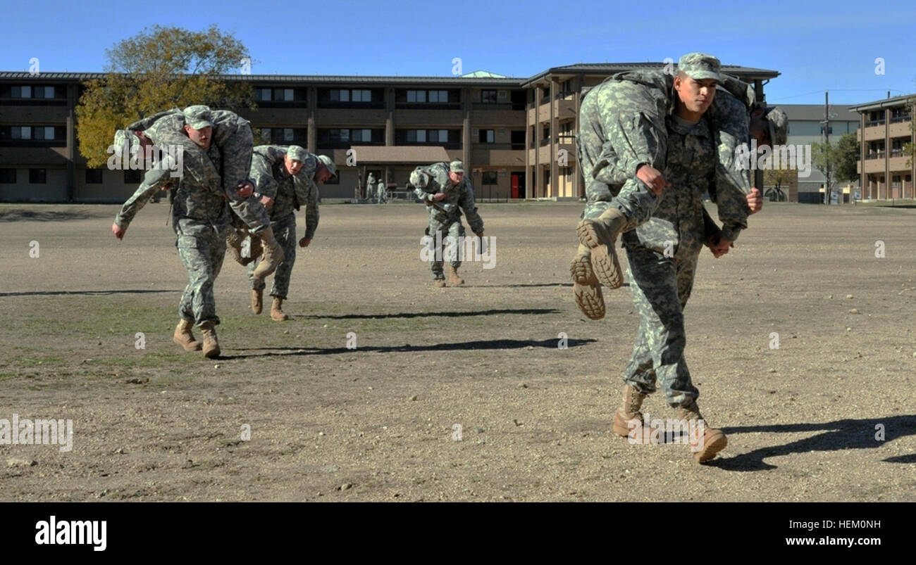 Soldiers with 1st Squadron (Tiger), 3rd Cavalry Regiment perform buddy carries during a Ranger School Assessment Program, Dec. 2. The program is a rigorous, 48-hour assessment of the soldiers’ ability to conduct specific tasks while under extreme physical and mental stress. Out of the comfort zone 111202-A-CA152-002 Stock Photo