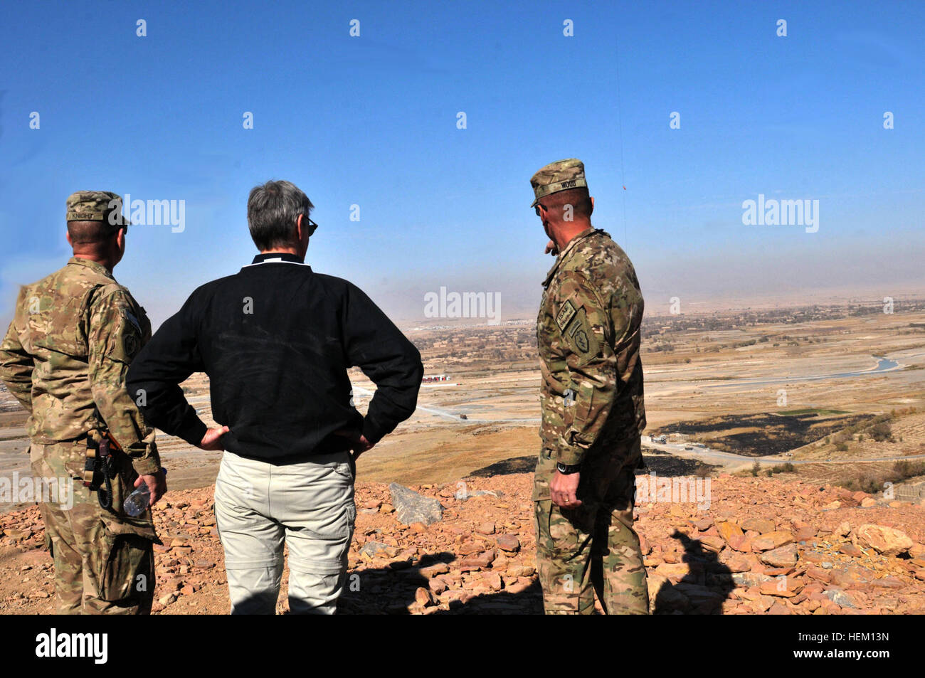 Col. Todd Wood, commander of the 1st Stryker Brigade Combat Team, 25th Infantry Division, and Command Sgt. Maj. Bernie Knight show Secretary of the Army John M. McHugh the view overlooking Panjwa'i district from Forward Operating Base Masum Ghar Dec. 14. Secretary of the Army visits Panjwa'i, Afghanistan 111214-A-AX238-012 Stock Photo