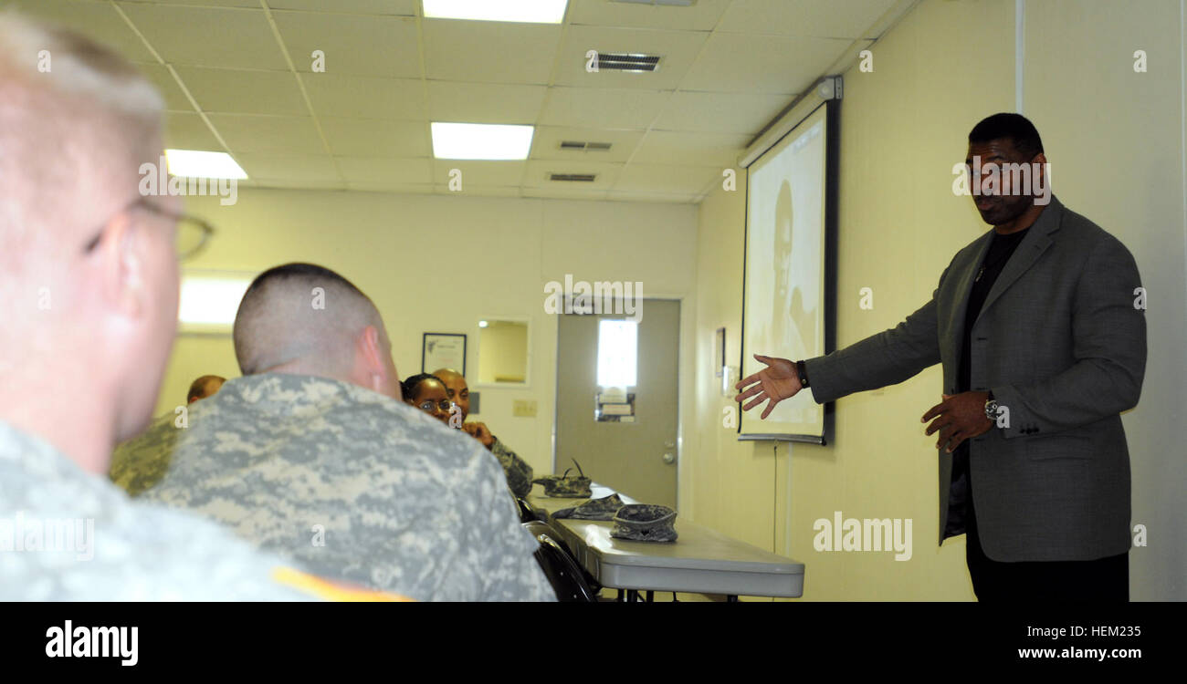 Heisman Trophy winner and former Dallas Cowboys running back Hershel Walker speaks to members of the Warrior Transition Battalion Jan. 24. Walker was visiting members of Fort Bliss to spread the message of seeking help if you have behavioral health issues. Walker speaks with Wounded Warriors 120124-A-KJ276-002 Stock Photo