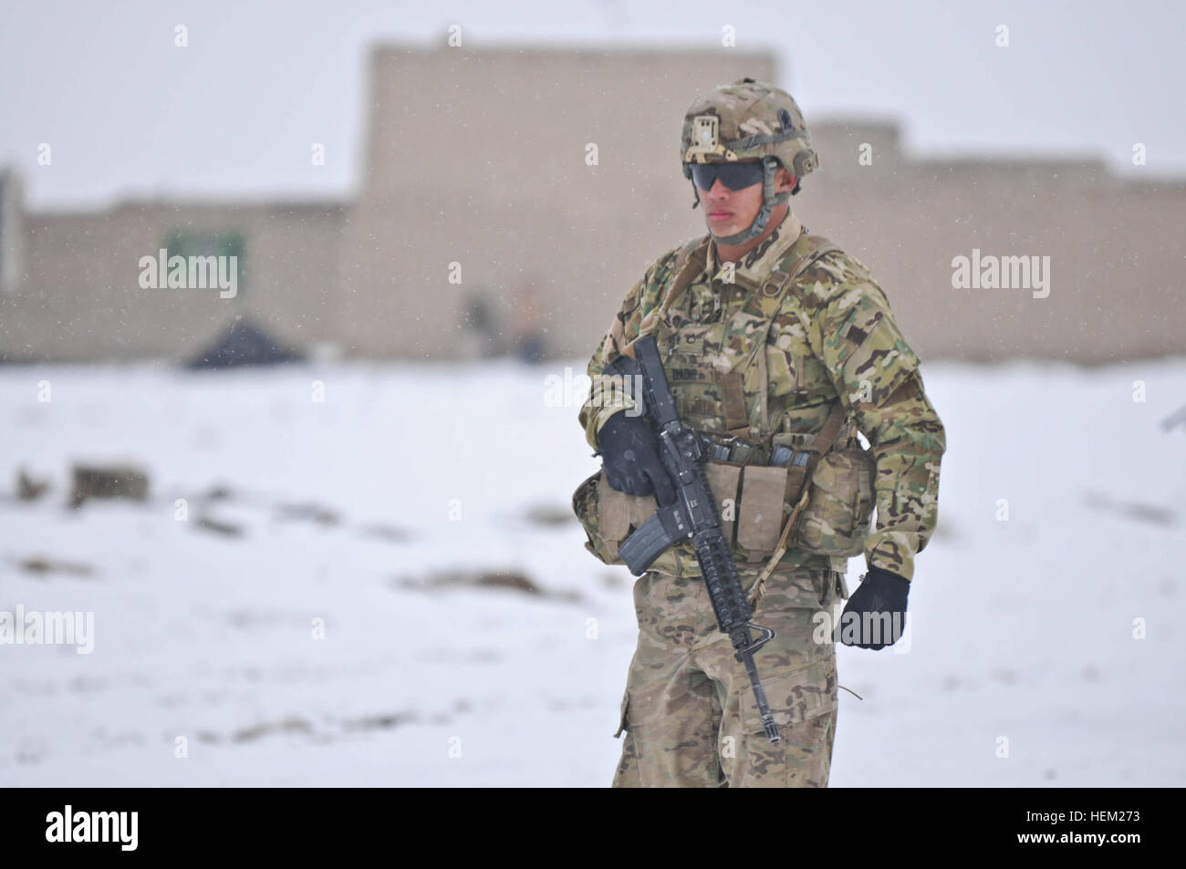 Pfc. Nick Badis, an infantryman from Highland, Calif., assigned to Dog Company, Task Force Gold Geronimo conducts a security patrol in the Paktya province, Jan. 30. TF Gold Geronimo is part of the Spartan Brigade. Dog Company, Gold Geronimo on patrol 516583 Stock Photo