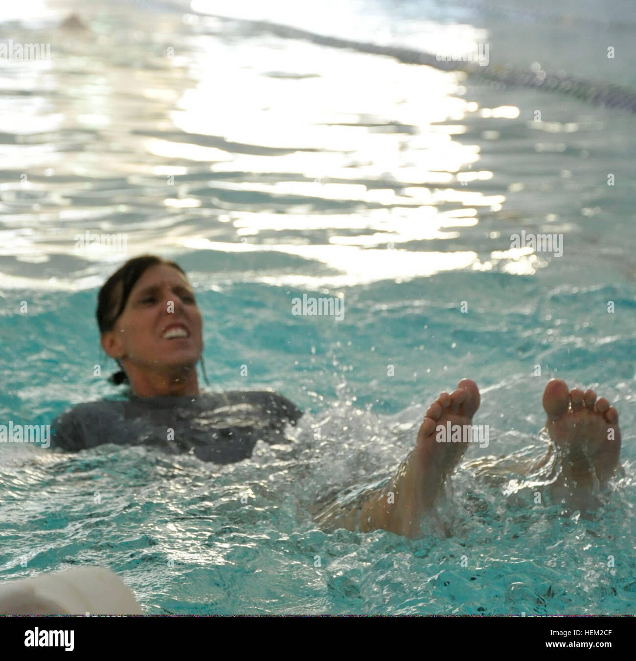 Army Pfc. Hope Clark floats on her back during an aquatics