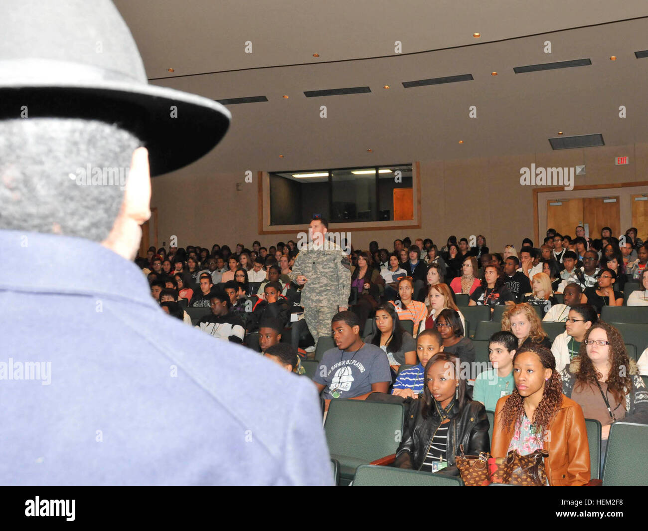 Lt. Col. Cameron Cantlon, the commander for the 6th Squadron, 9th Cavalry Regiment, 3rd Brigade Combat Team, 1st Cavalry Division, gives a lesson to high school students about Buffalo Soldiers and their relation to the 9th Cavalry Regiment during Black History Month. This is part of Adopt-a-School program held at Ellison High School, Feb. 8, 2012. Saber Squadron commemorates black history at Ellison High School 120208-A--011 Stock Photo