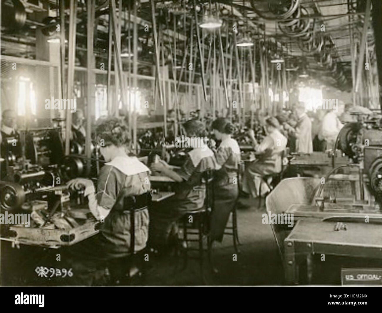 Workers assemble components of a Browning machine gun during a ...