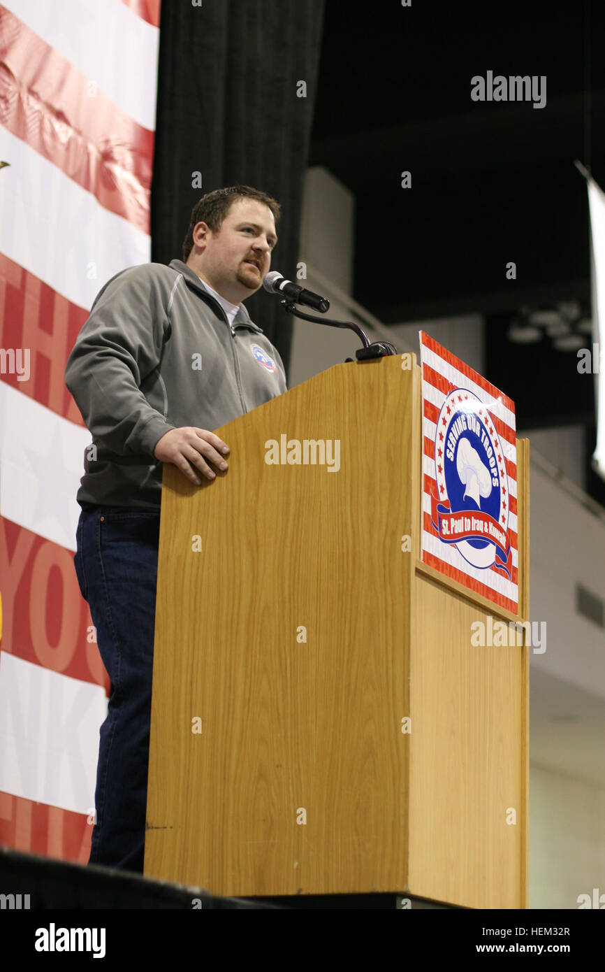 John Marshall, Serving Our Troops organization, speaks to guests at an event at the RiverCentre in St. Paul, Minn. on Feb. 25, 2012.   The Serving Our Troops volunteers served more than 3,000 steak dinners to the families of deployed Minnesota National Guard 1st Brigade Combat Team soldiers. The group also simultaneously served approximately 13,000 steak dinners to service members at five military bases in and around Kuwait City.) Dinner with the family, One simple reason Serving Our Troops brings families together 120225-A-BO186-030 Stock Photo