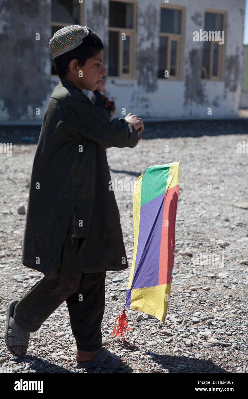 A local boy plays with a kite at Kolk, Kandahar province, Afghanistan, Feb. 29, 2012. Kite Day 120229-A-VB845-084 Stock Photo