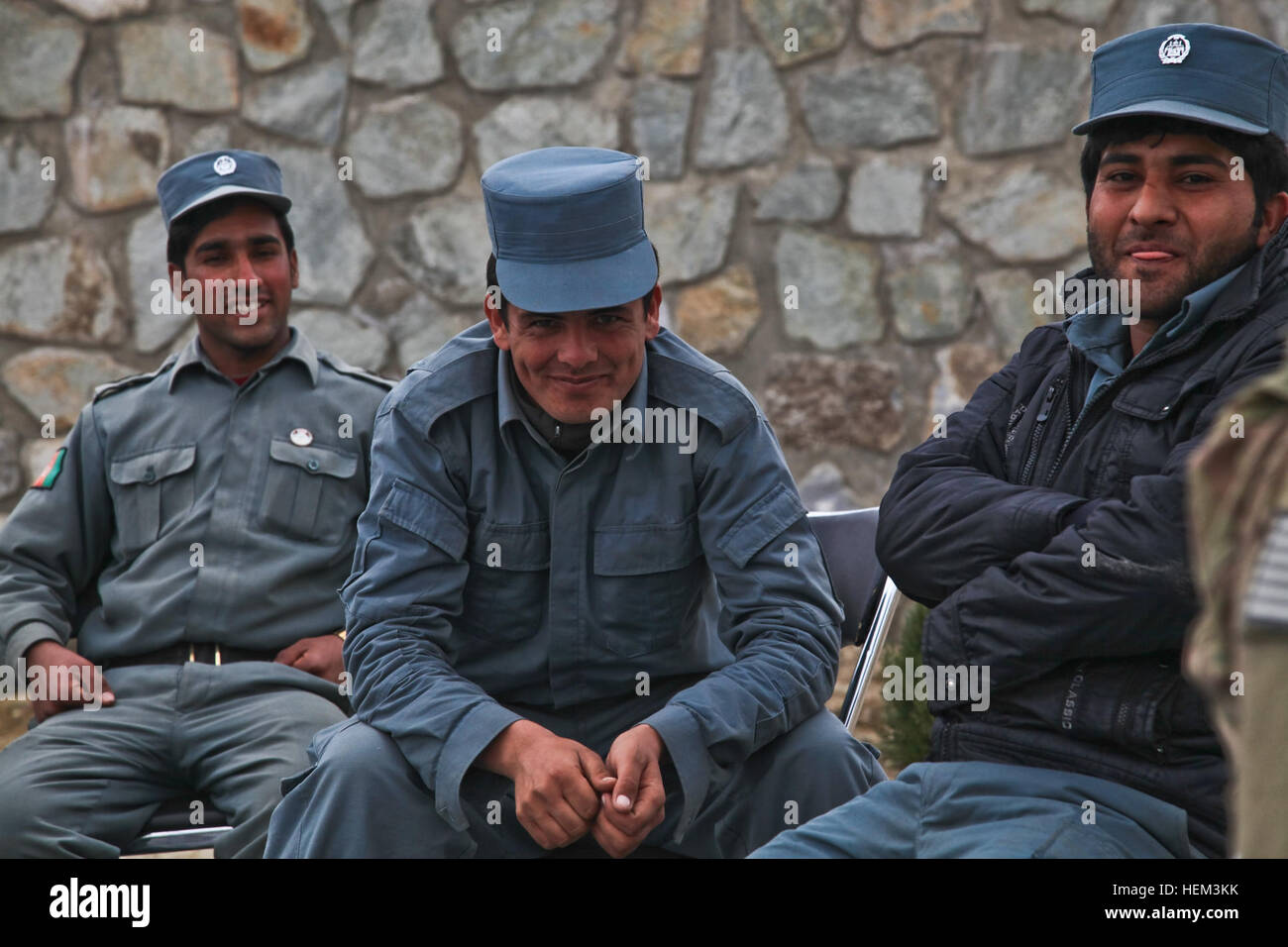 Members of the Afghan Uniformed Police smile at the camera during a Key Leader Engagement, Nazyan district, Nangarhar province, Afghanistan, March 15, 2012. The purpose of the mission was to gain familiarization of the district and key leadership. Key Leader Engagement 120315-A-LP603-156 Stock Photo