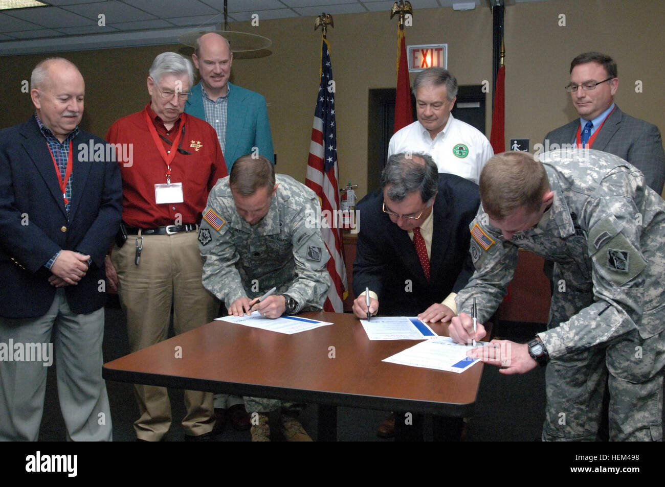 Lt. Col. James A. DeLapp (left at table), U.S. Army Corps of Engineers Nashville District commander; Robert J. Martineau Jr. (center at table), Tennessee Department of Environmental Conservation commissioner; and Col. Vernie L. Reichling (right at table), Memphis District commander, sign a partnership agreement, March 30, 2012, in Nashville, Tenn., between the corps of Engineers and Tennessee state agencies that reaffirms a commitment to cooperate and communicate with each other to achieve mutual water resource goals aimed at improved quality of life for citizens. Other signatories standing (L Stock Photo