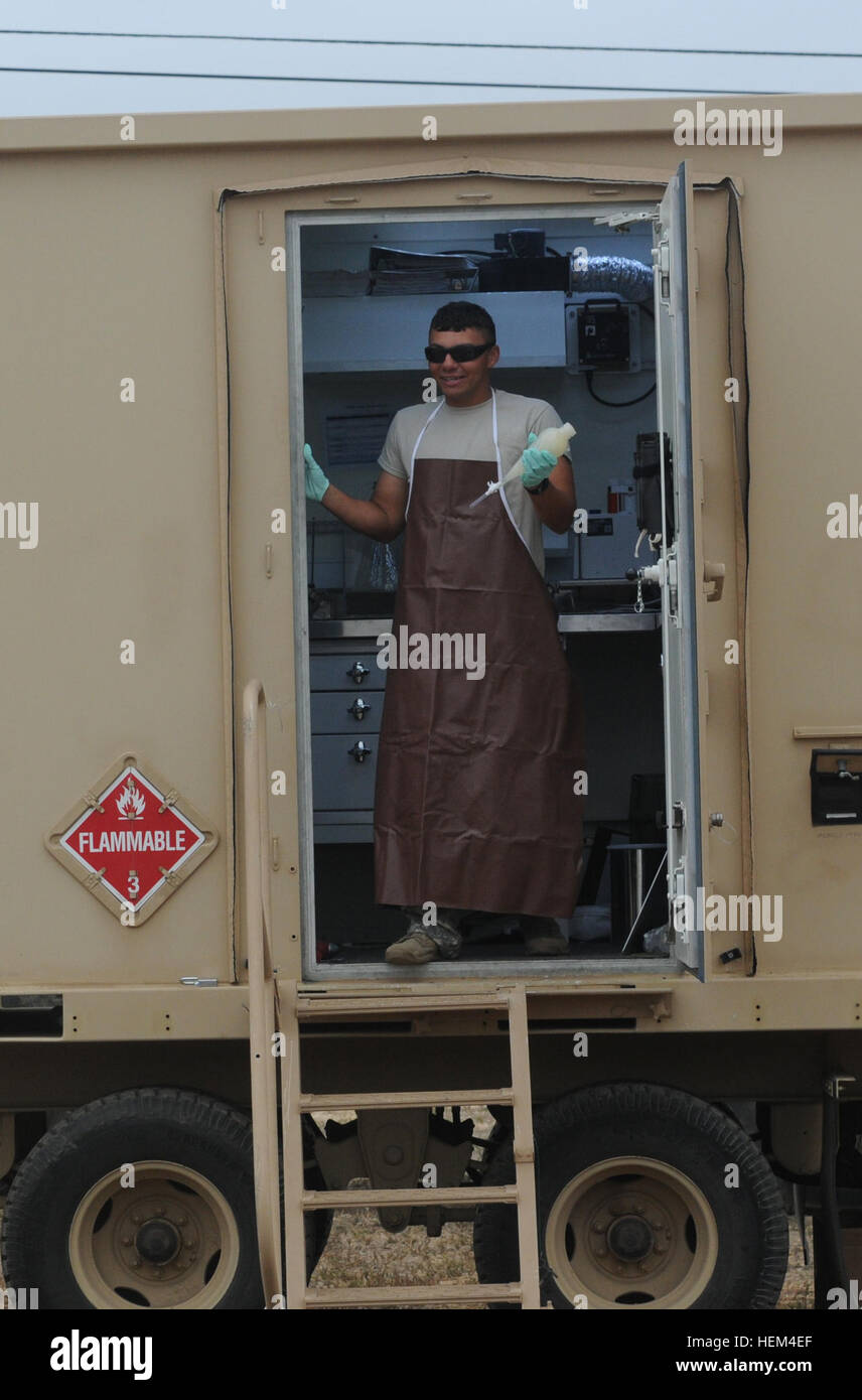 U.S. Army Sgt. Rodriguez, a petroleum supply specialist operates a mobile chemical lab for testing fuel quality in Camp Pendleton, Calif., as part of Quartermaster Liquid Logistics Exercise 2014. QLLEX is a joint forces exercise that 64 units at eight locations across the continental U.S. will deliver more than 3.25 million gallons of petroleum and produce 479,000 gallons of water, designed to challenge and develop the battalion's staff military decision making skills. (US Army photo by Sgt. Alejandro C. Canizales/Released) QLLEX 2014 140610-A-ON601-005 Stock Photo