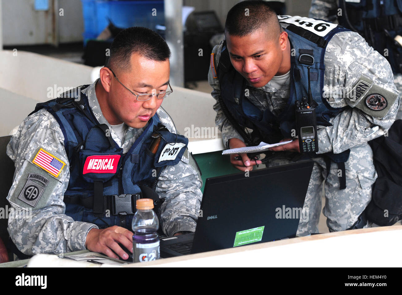Army Capt. Samuel Cho, medical operations officer, 9th Civil Support Team, California National Guard, reviews possible medical evacuation routes with Army Capt. Fernando Perez, operations officer, 9th CST, during a training event on Coconut Island in Kaneohe Bay April 24, 2012. The training event was part of the much larger Kai Malu 'O Hawaii operation, which tested the area maritime security response plan to threats of possible weapons of mass destruction. California CST deploys to Coconut Island 120424-A-DL064-934 Stock Photo