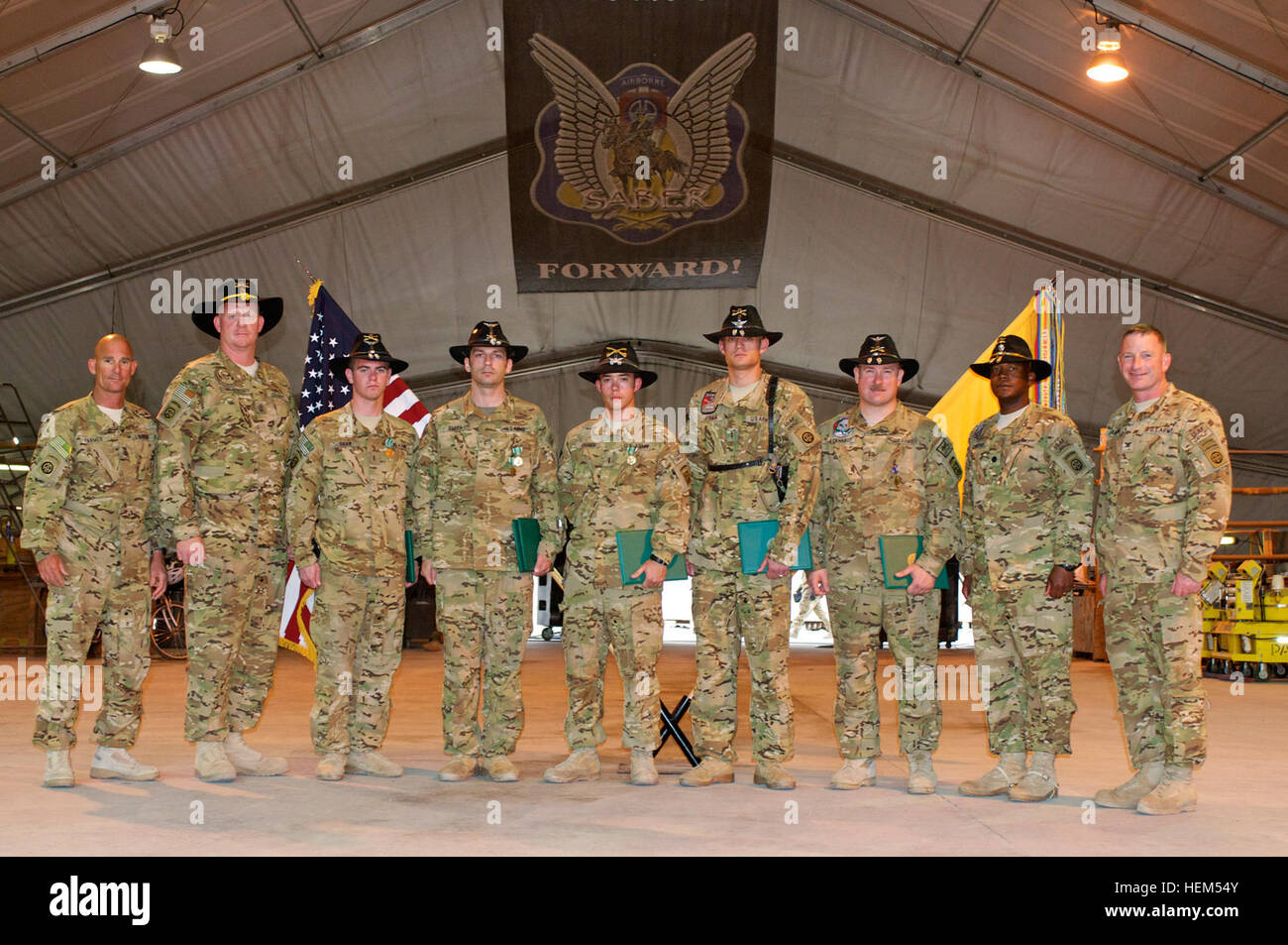 82nd Combat Aviation Brigade leadership poses with medal recipients on Forward Operating Base Fenty, Afghanistan, April 26.  Pictured from left to right: 82nd Combat Aviation Brigade Command Sgt. Maj. Larry Farmer, of San Diego, Calif.; 1st Sgt. Daniel Moesch, of Ithaca, N.Y.; Chief Warrant Officer 2 Clifford Shaw, of Melbourne, Fla.; Chief Warrant Officer 2 Jason Smith, of Little Falls, N.Y.; Chief Warrant Officer 3 David Briggs, of Toledo, Wash.; Chief Warrant Officer 2 Bradley Greer, of Birmingham, Ala.; Chief Warrant Officer 3 Michael Eckhardt; Lt. Col. Jeffrey Cheeks, Task Force Saber com Stock Photo