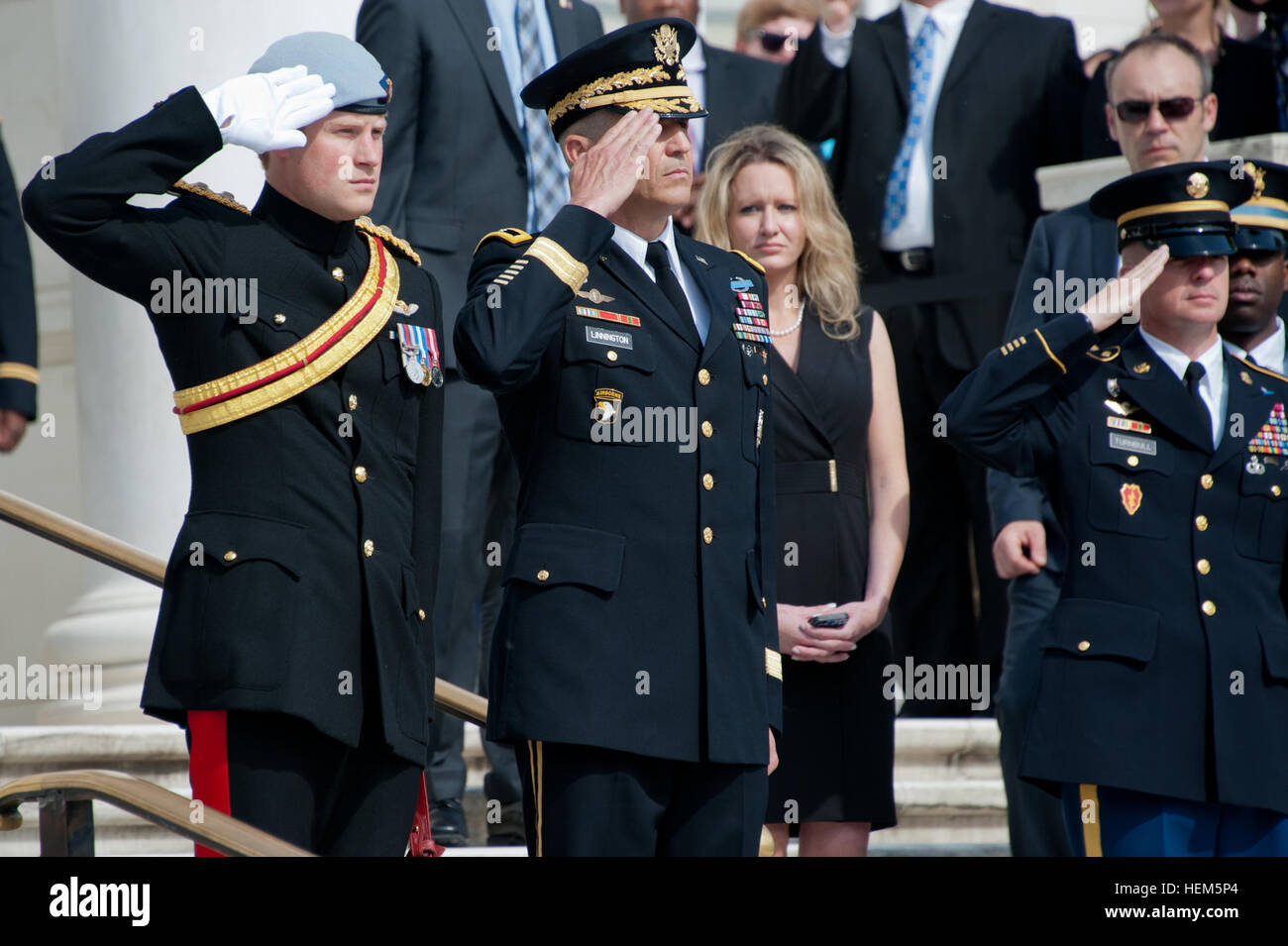 British Royal Army Captain (Prince) Harry Wales, and Maj. Gen. Michael S. Linnington, Military District of Washington Commander, salute during the playing of the British and American national anthems at the Tomb of the Unknowns in Arlington National Cemetery, Va., May 10, 2013. (U.S. Army Photo by Sgt. Laura Buchta/Released) Prince Harry of Wales Arlington visit 130510-A-VS818-300 Stock Photo