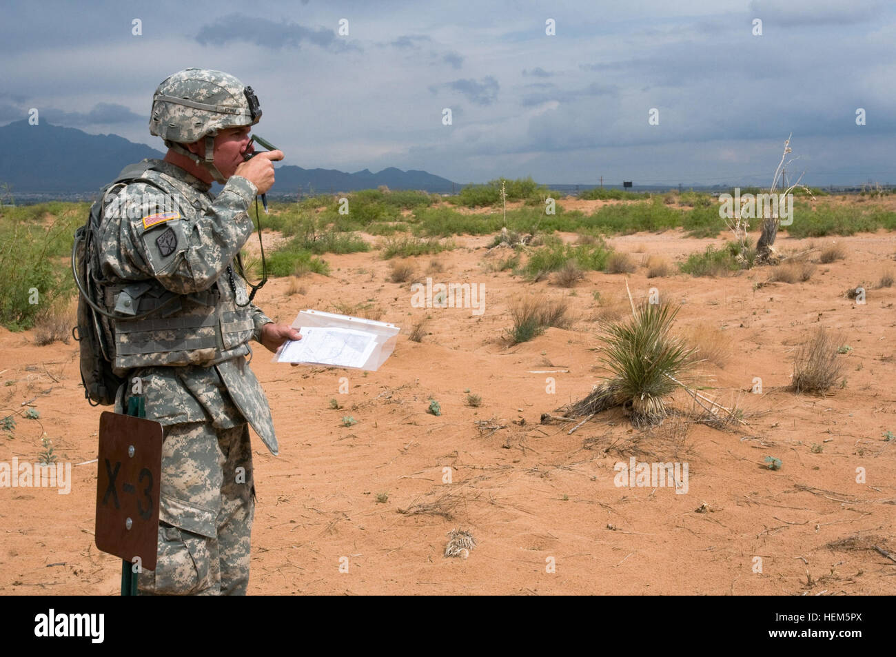 Spc. Steven Eppley, a Bakersfield, Calif., native and driver with A Company, 123rd Brigade Support Battalion, verifies his direction before moving to his next location during the land navigation phase of the Order of the Sustainer Challenge at Fort Bliss, Texas, May 9, 2012. Equipped with a map, compass and protractor, soldiers were required to discover three out of four locations in an almost two-mile square course. 123rd BSB upholds the Order of the Sustainer Challenge 120509-A-VF572-013 Stock Photo