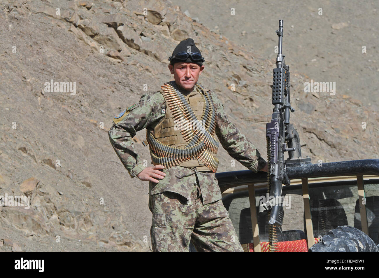 An Afghan National Army soldier pulls security in the Shewak district ...