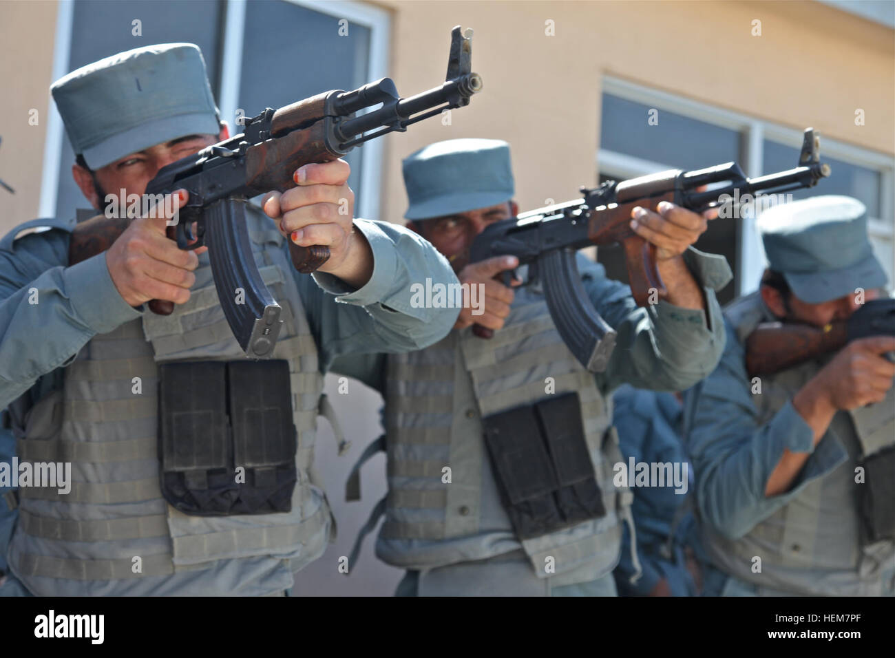 A group of Afghan Uniform Police recruits aim their assigned AK-47 assault  rifles down range as they practice the fundamentals of shooting during  firearms training at Forward Operating Base Shank, Logar province,
