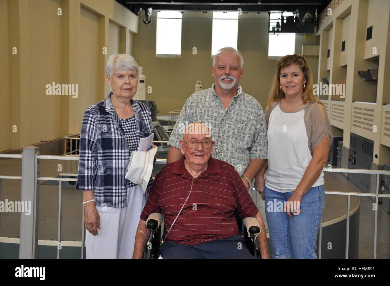 Tom Nixon, 83, who worked on the construction of the U.S. Army Corps of Engineers Nashville District Center Hill Dam that was completed for flood control in 1948, shared memories with employees and other visitors July 21, 2012. From left in background are Nixon's wife, Dot; son, David; and daughter-in-law, Gloria. Many younger folks don't remember the flooding that occurred almost annually before the dam was built, according to Nixon. Center Hill Lake open house, power plant tours draw young, elderly visitors 120721-A-HL948-002 Stock Photo
