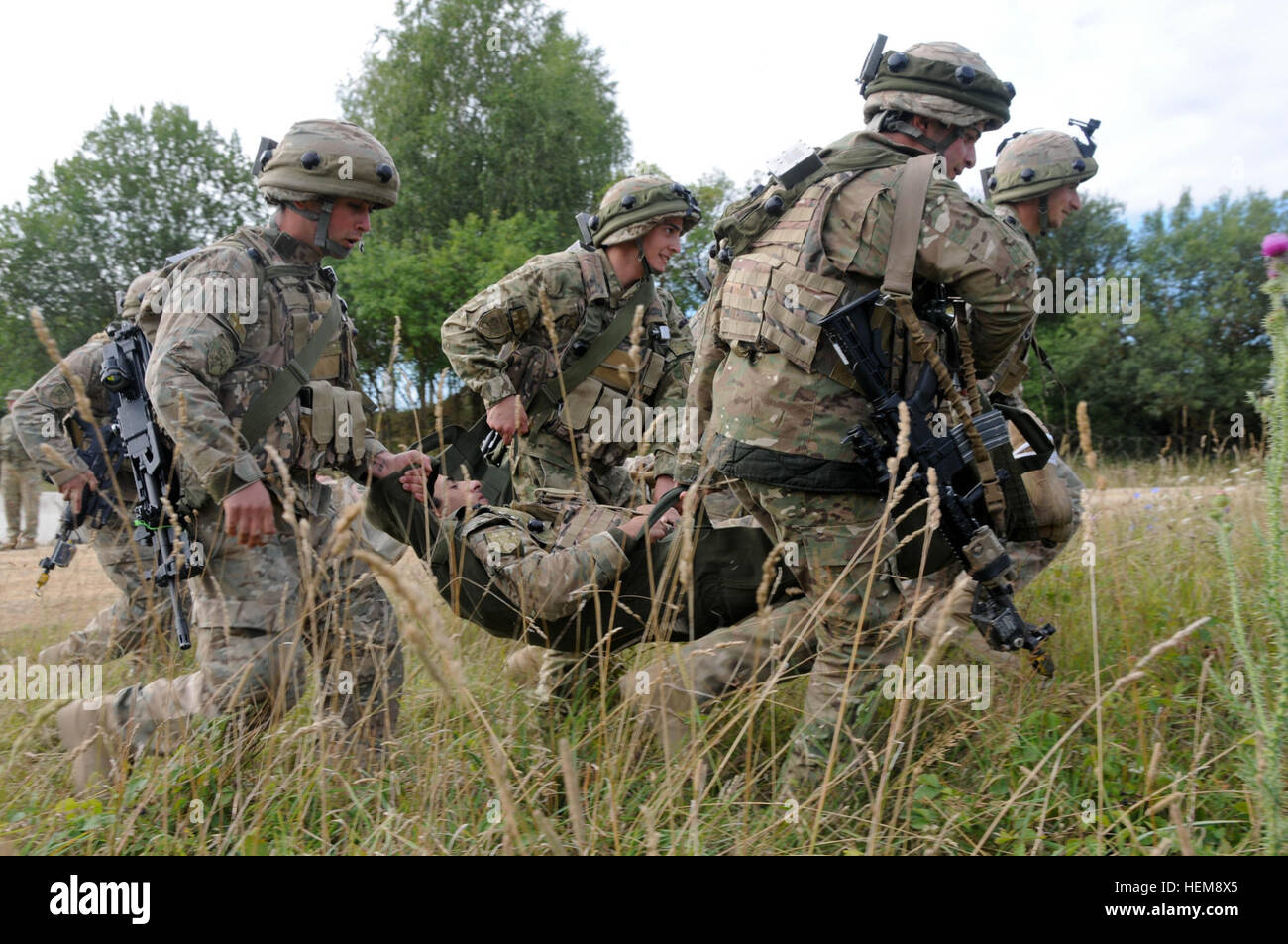 Georgian soldiers from the 32nd Infantry Battalion carry a casualty for ...
