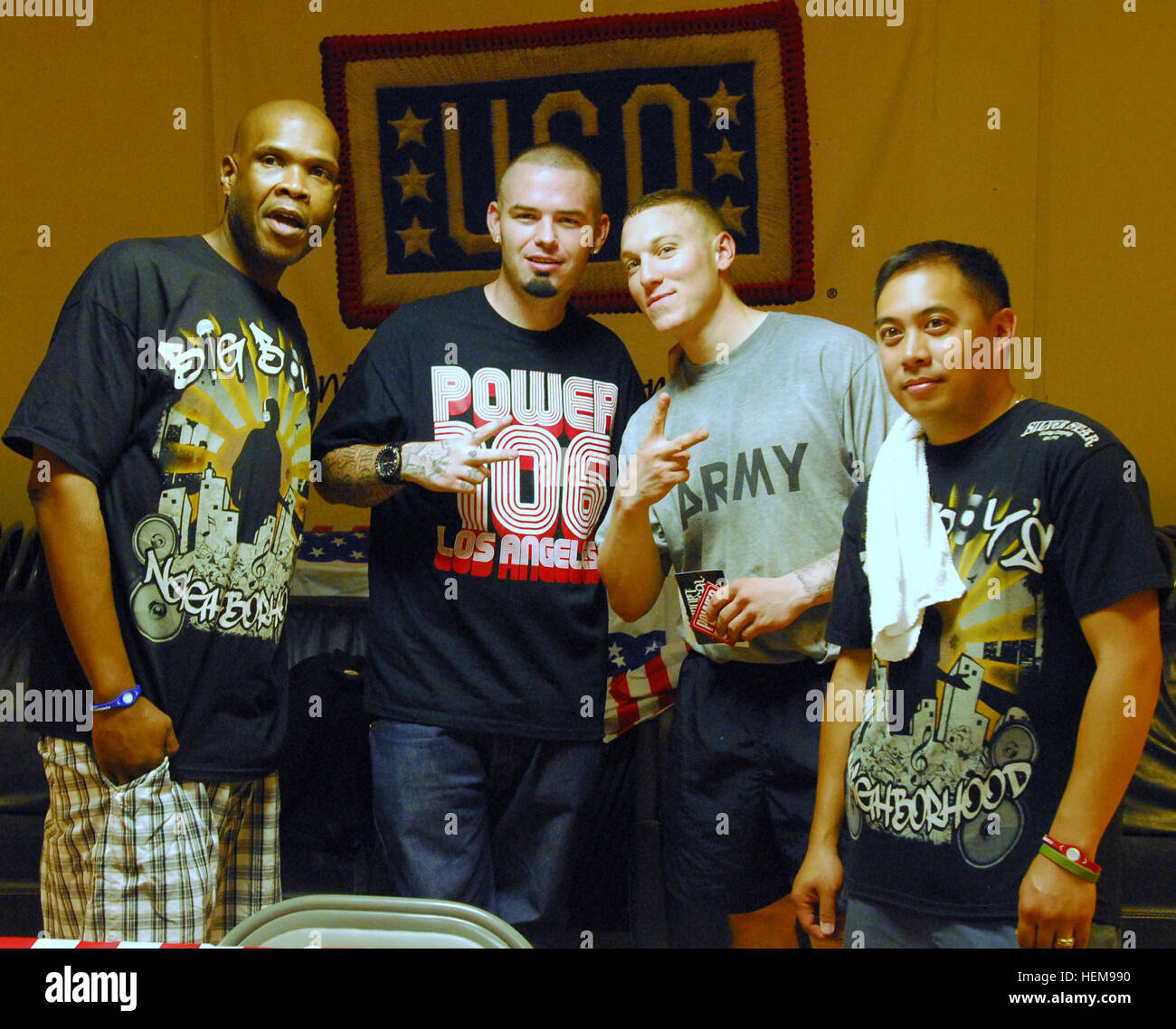 From left to right, Big Boy, Paul Wall, Pfc. Chase Clark, a tanker with Company C, 1st Battalion, 30th Infantry Regiment, 2nd Heavy Brigade Combat Team, 3rd Infantry Division, and DJ E-Man, pose for a photo, following their hour-long USO/Armed Forces Entertainment sponsored performance at Forward Operating Base Warrior, Kirkuk, Iraq, Aug. 5. Rapper Paul Wall, L.A. Radio Hosts Tour Iraq 307205 Stock Photo