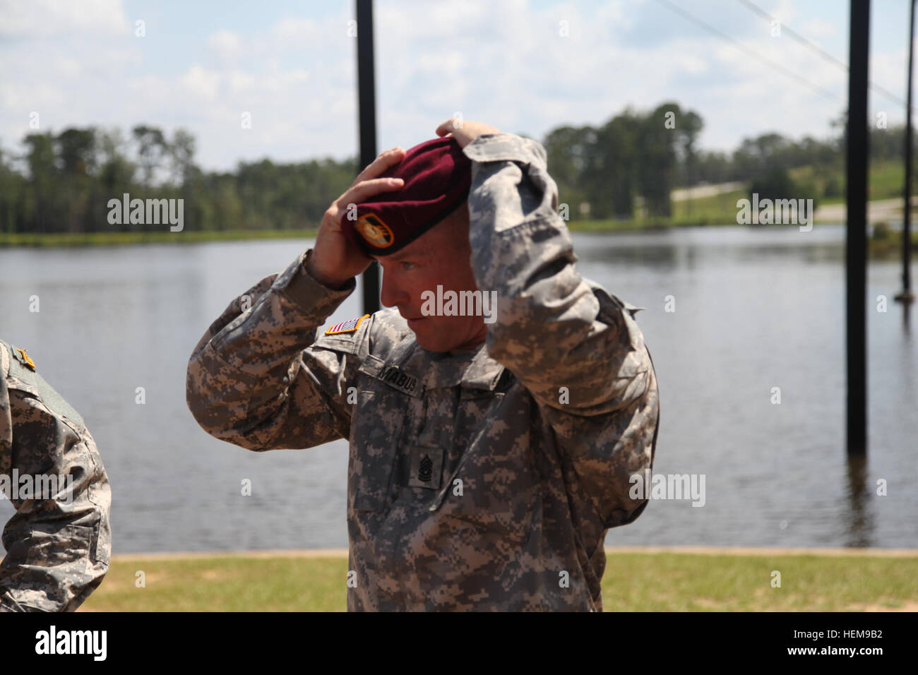 Command Sgt. Maj. Mabus dons his maroon beret, rank, and all patches and proclaimed 'I'm back!' signaling his readiness to return to the unit and Fort Bragg. CSM Mabus Ranger School Graduation 120824-A-MY599-138 Stock Photo