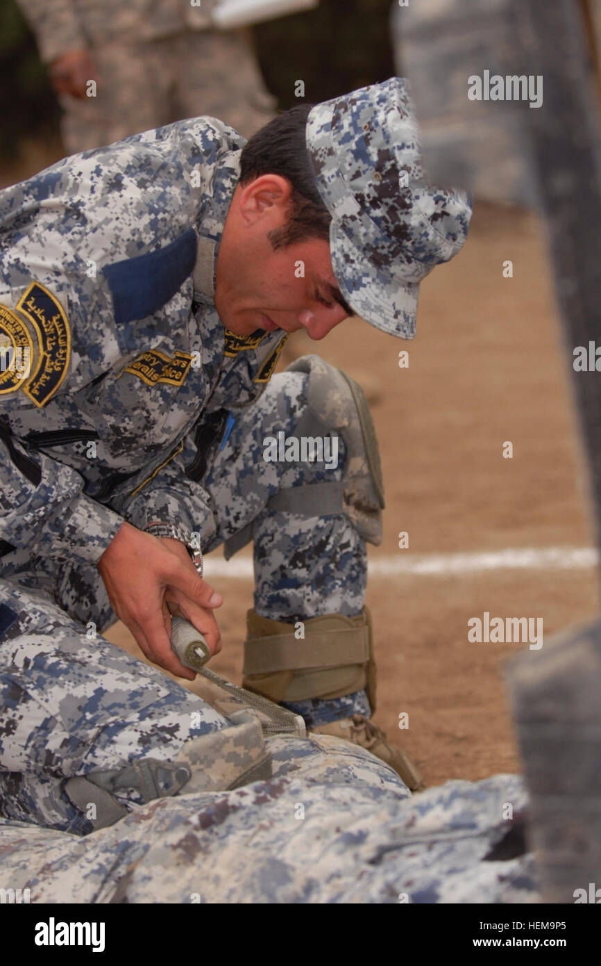 Iraqi Federal Police personnel conduct first aid training during a ...