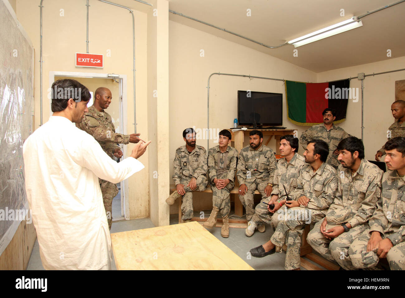 U.S. Army Spc. Raymond Greene, assigned to Team Hatchet, 1st Battalion (Airborne), 501st Infantry Regiment, Task Force 4-25, teaches a map reading class to Afghan Border Police officers on Combat Outpost Bowri Tana, Khost province, Afghanistan, Sept. 9, 2012. (U.S. Army photo by Sgt. Kimberly Trumbull/Released) ABP map class 120909-A-PO167-012 Stock Photo